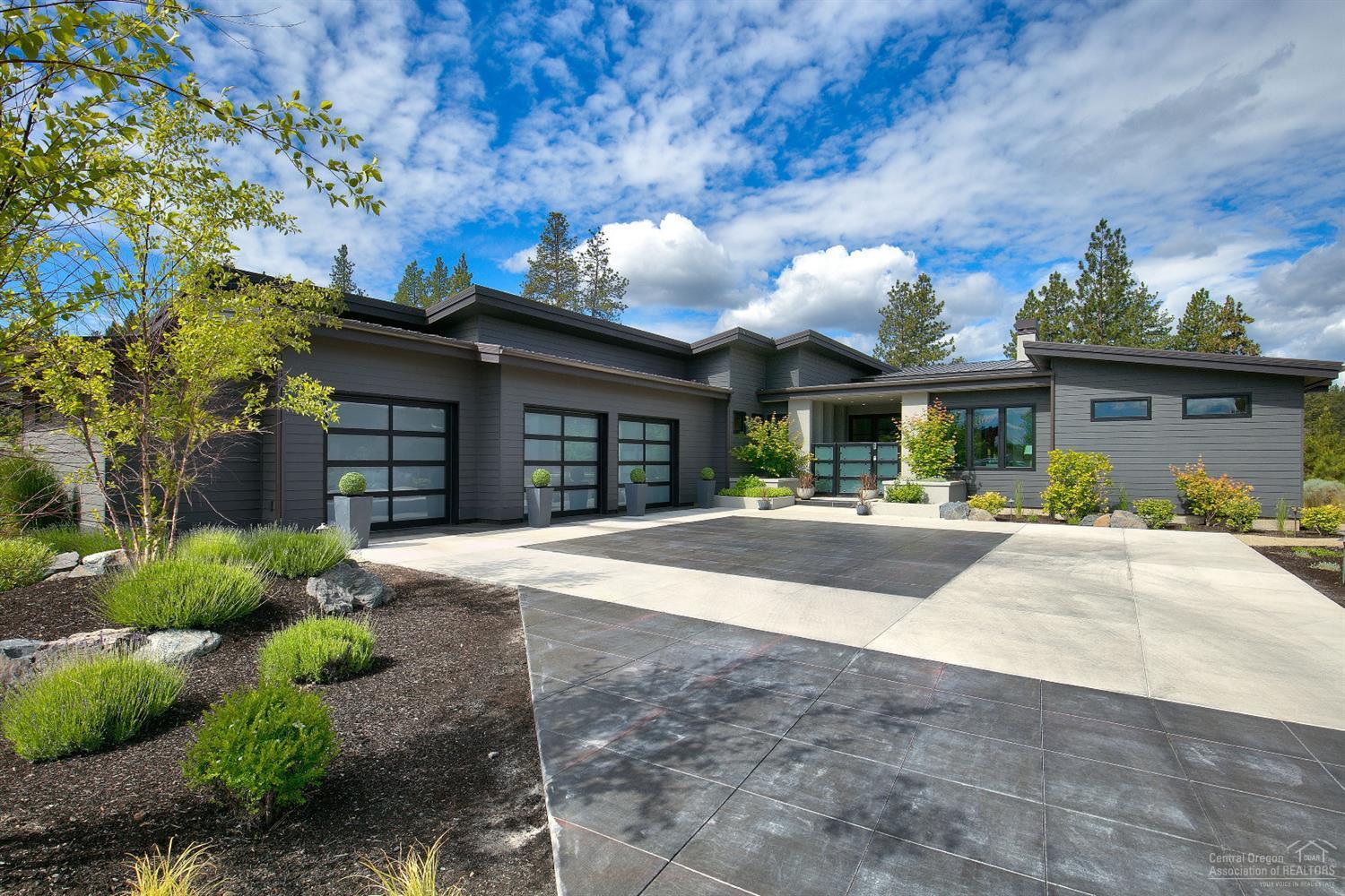 This stunning home is one of the jewels of Tetherow. The highest level of build quality with no expense spared. The home was featured on the 2017 Tour of Homes and received awards for Best Feature (outdoor living area), Best Kitchen, Best Interior Finish, Best Landscaping & overall Best in Show. The interior of the home impresses from the minute you step inside. An open floor plan is highlighted by two stacking glass wall panels for seamless indoor outdoor living. Chef's kitchen with wrap around windows, counter to ceiling subway tile, top of the line appliances and an oversized butler pantry. The master suite has a generous sitting area, fireplace, & wall to wall windows. A steam shower & herringbone marble heated floors complete the spa like setting. The covered - and uncovered - area of the outdoor patio has radiant floor heat with plenty of space to entertain. Thoughtful design and the comfort of knowing the quality and reputation of Sun Forest Builders is behind the home.