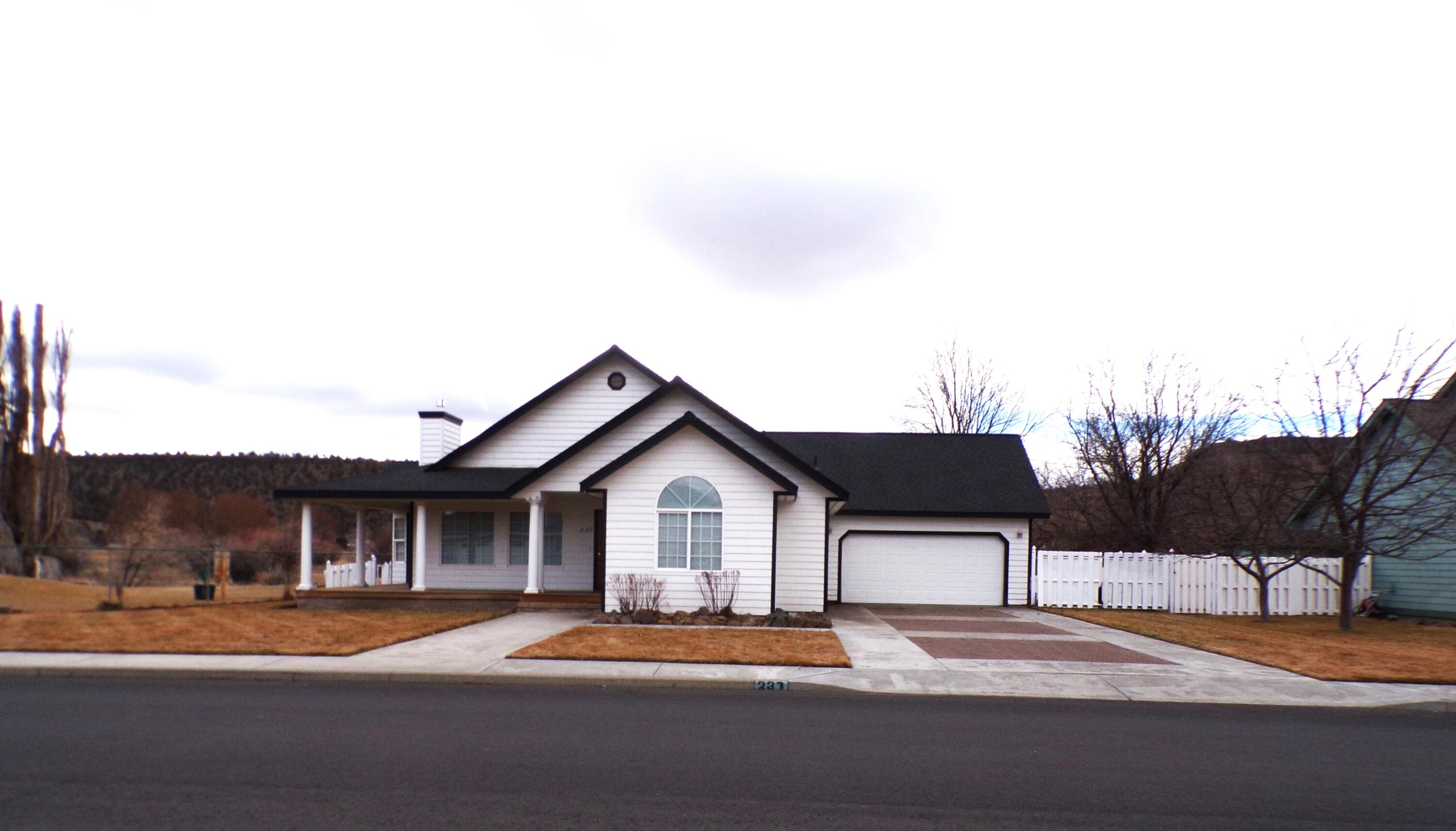 One-of-a-kind home in Prineville with Golf Course views and backs to the Crooked River 
Custom built home with 3 bedrooms, 2 bathrooms, and 1770 Square Feet of living space. Home features hardwood entry, vaulted living room with gas fireplace and bay windows. Island kitchen with custom hardwood cabinets, solid surface countertops, gas stove, and bay window breakfast nook. Custom Mahogany wrap-around covered deck in front and back. Back yard sits off the 10th tee box of Meadow Lakes golf course with private access to the Crooked River – great area for outdoor entertaining or just relaxing and watching the river go by.