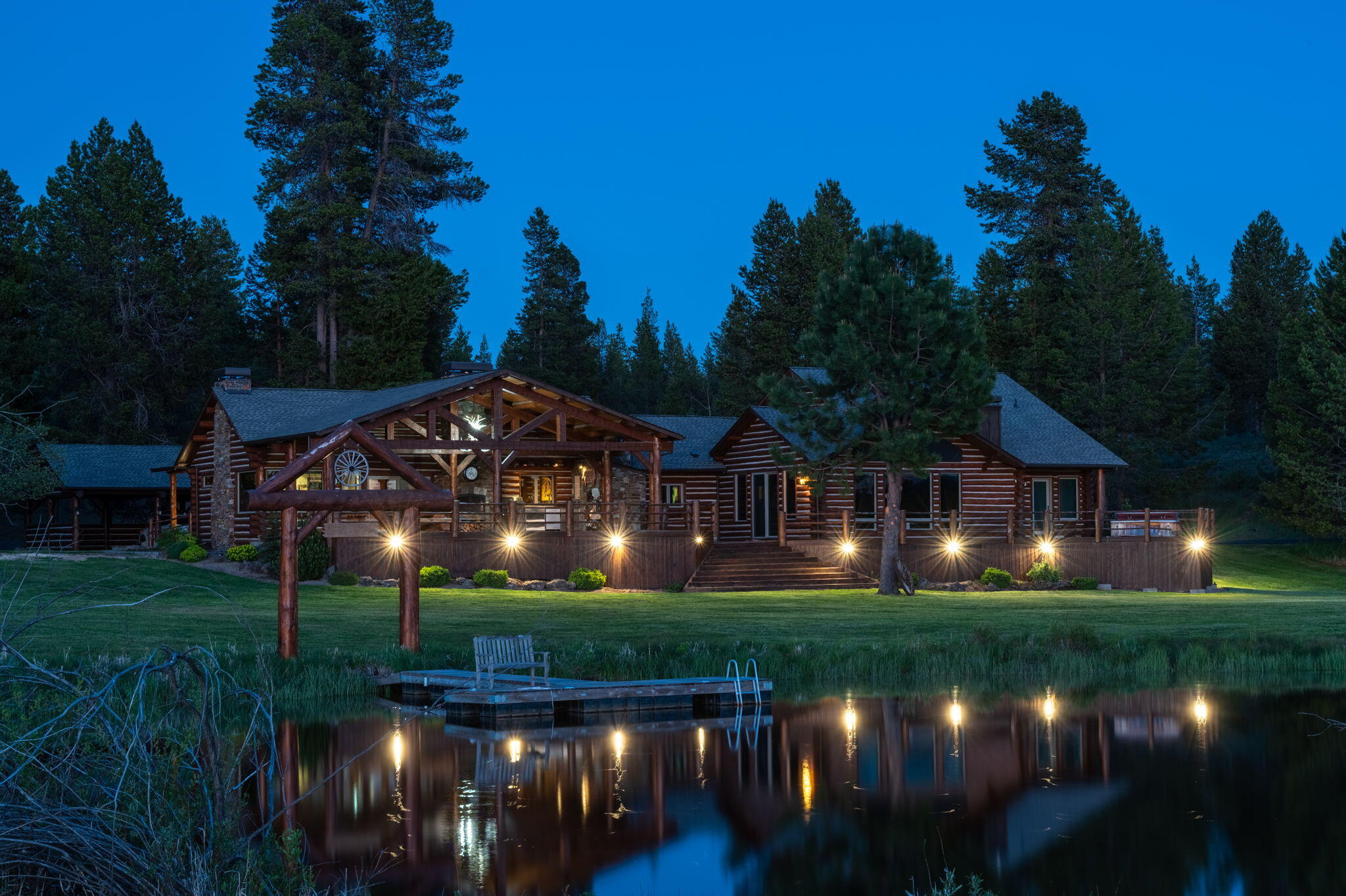 K BAR J RANCH - Stunning property with so much to offer. Some of the highlights include the beautiful main home with amazing river and mountain view. Hugh deck overlooking river and pond with its own dock. Main home site includes separate office that can also be living area, horse barn with several stalls, fenced horse area, and huge hoppy barn with rec. room/over-sized garage area. The property has miles of river frontage and miles of paved walking roads. Own your own piece of Heaven only minutes from town!