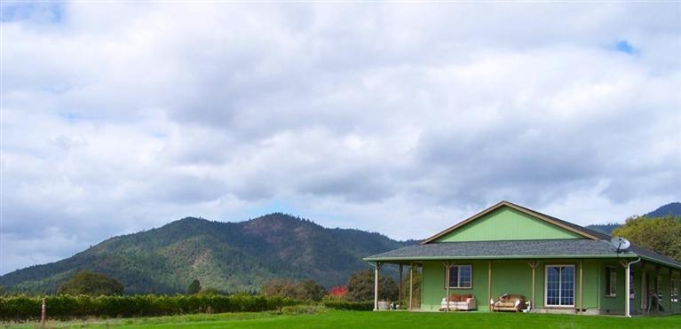 37+ acres in the heart of the Applegate Valley next to Troon Winery, with nice 1,984 s/f rancher resting amongst picturesque vineyards and overlooking a four‐acre bass stocked lake on the adjoining vineyard estate which is also available, (see MLS#52940639) with extensive landscaping in addition to the elegant residence. Vineyards: 18 +/- Acres Planted, with 14 +/- additional plantable acres. Water: Two wells: 1) Approximately 20 gpm for domestic and irrigation for the neighboring parcel under Permit G 16184, 2) Approximately 50 gpm for domestic and irrigation for the subject parcel under Permit G 16184.