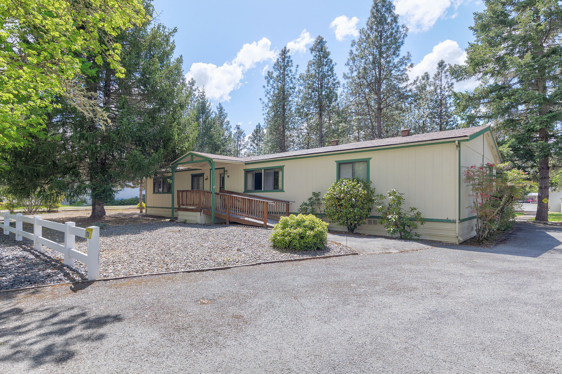 Located in North Valley Mobile Home Estates and sitting on .24 of an acre this 1984 Manufactured home features 3 bedrooms, 2 bedrooms, approx. 1848 sqft., large living room with vaulted ceiling &  certified woodstove, dining room, kitchen, laundry room, new floors in 2009 and new heat pump in 2014.  Large primary bedroom and primary bathroom w/separate tub & shower, double sinks.  Main bathroom with tub/shower combo.  Large screened in porch out back leading to carport.  Shed out back is 8 x 10.  All appliances included!  HOA fee $125/quarter, includes septic pumping, water and maintenance of common areas.