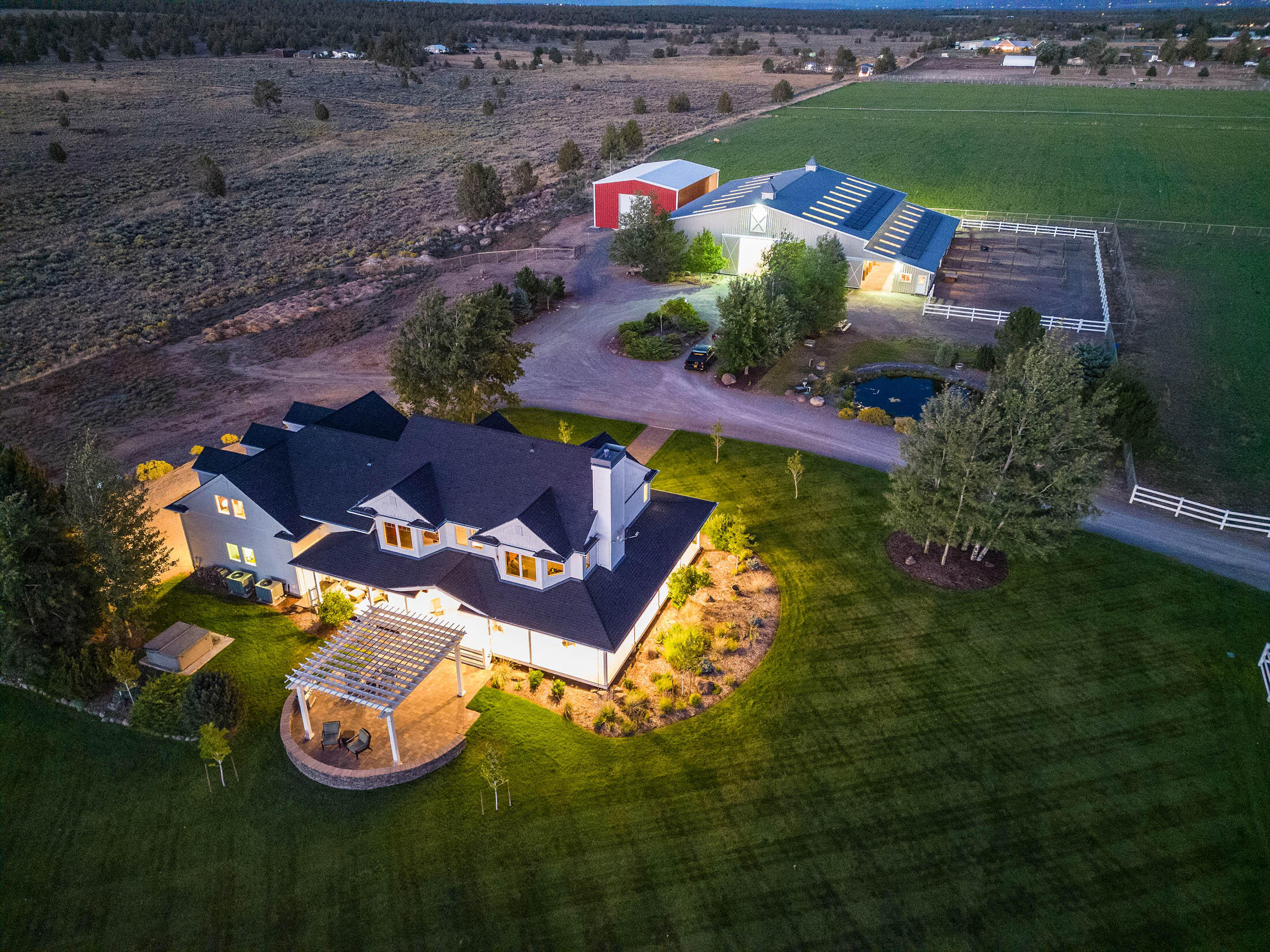 The Seven Peaks Estate is one of the nicest and most well-kept properties of the prestigious Tumalo community. This 31± acre property, with views of 7 majestic peaks that define the Central Oregon landscape, is a marvel of amenities for people and horses. The 3,400 ± square foot craftsman style home with 4 bedrooms, 3 bathrooms and a wraparound porch is meticulously cared for and boasts new upgrades, including new hardwood floors, window tinting and smart home technology. The back patio, and expansive lawn and landscaping, beg for the next gathering of family or friends to enjoy the Cascade Mountain views and Central Oregon climate. The horse lover will be hard pressed to find a complaint in the 5-stall barn with tack room and an indoor arena. Your horses will have the run of multiple paddocks (dry paddocks, irrigated grass filled pasture, and native range pasture). Take a stroll around the 19 ± acre irrigated hayfield of premium hay Central Oregon is known for. Come and see the views!