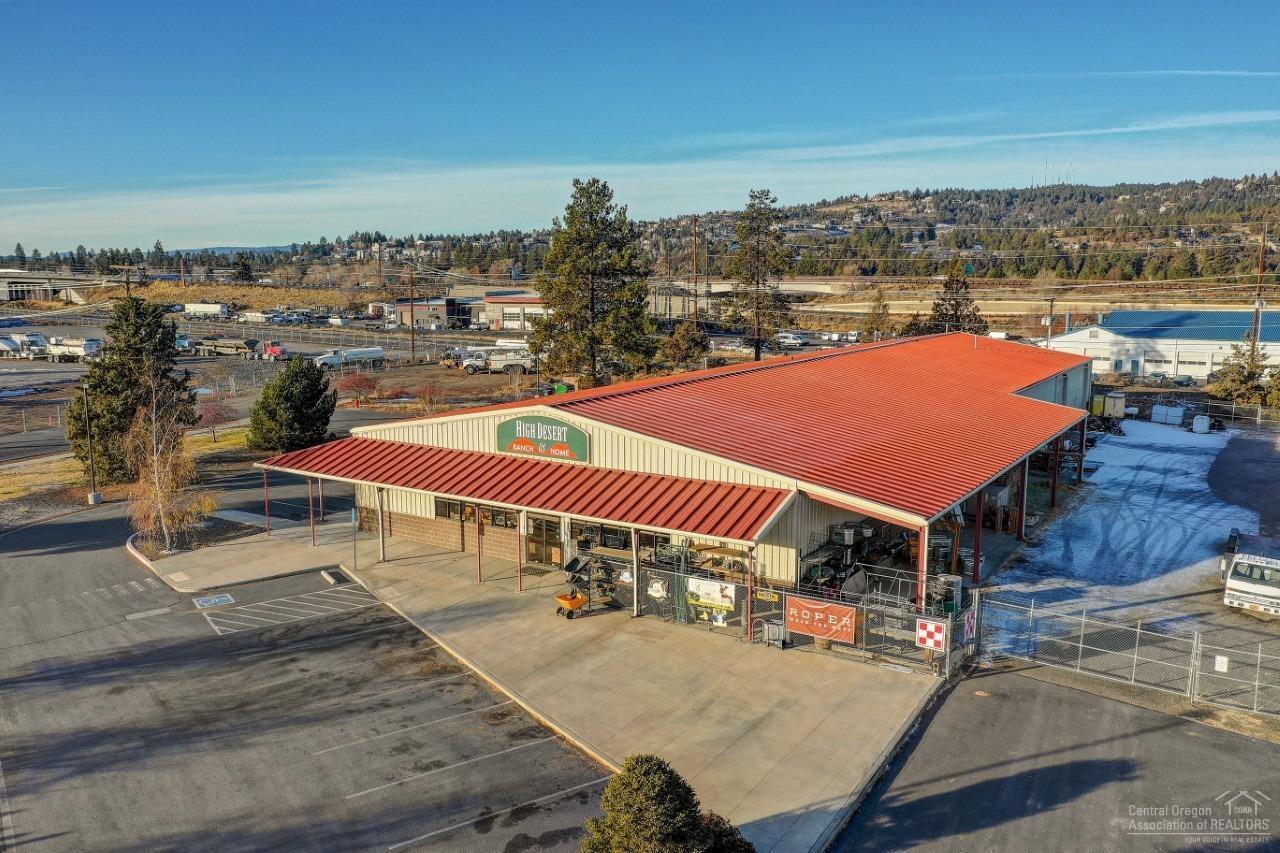Light Industrial/Flex Space +/-15000 SF steel building. Building divided into 3 large sections; Front section is +/-8000 SF retail, A/C and forced air heat. Mid section is +/-4000 SF warehouse with drive-thru loading bay, 12ft x 14ft roll up doors, kitchen/break room and offices. Rear section is +/-3000 SF shop area with drive-thru loading bay, 12ft x 14ft roll up doors, grease trap, oil water separator that pumps from front of building. Fully fenced north side gravel storage area, paved receiving and pick-up area, semi-capable delivery area, 14 parking spaces. Access off both 4th Street(Northeast) and Addison(South).
