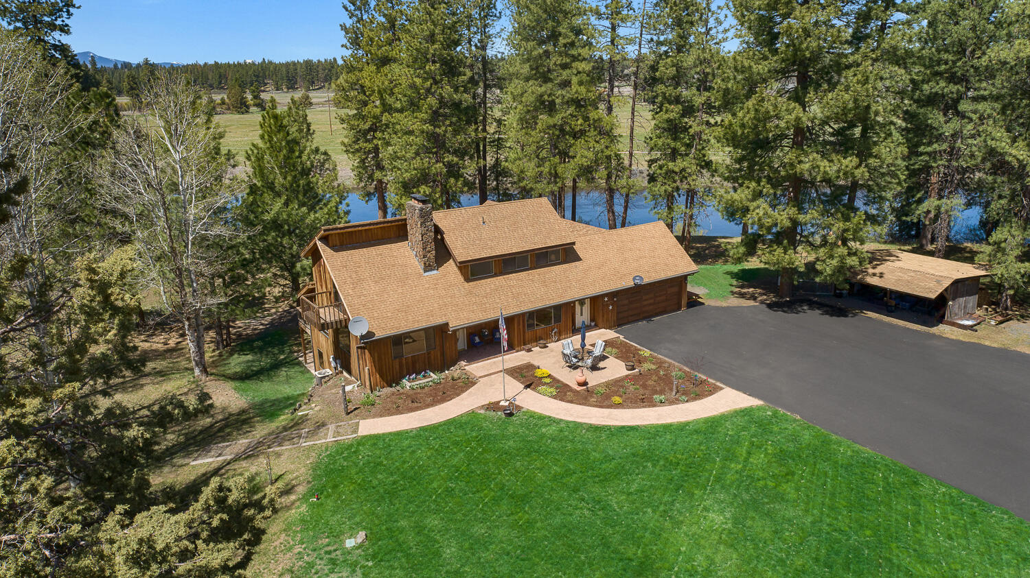 125-acre riverfront ranch with over 2,000 feet on Oregon's renowned Williamson River, one of the West's top trophy trout streams. The riverfront home has been tastefully updated with expansive great rooms, formal dining, and a modern kitchen. Outdoor amenities include entertaining area with wood-fired pizza oven & fire pit. Ag and equestrian features include irrigation, fenced horse pastures, stalls, a tack room, loafing shed, large hay barn (also suited as a covered arena), livestock barns, and a 40x60 shop with RV door and walk-in cooler. Kayak or fish from your front yard while enjoying privacy, scenery, and abundant wildlife. Located near Crater Lake, Klamath Lake, and premier birding routes, this property blends beauty, function, and recreation in the heart of Klamath County.
