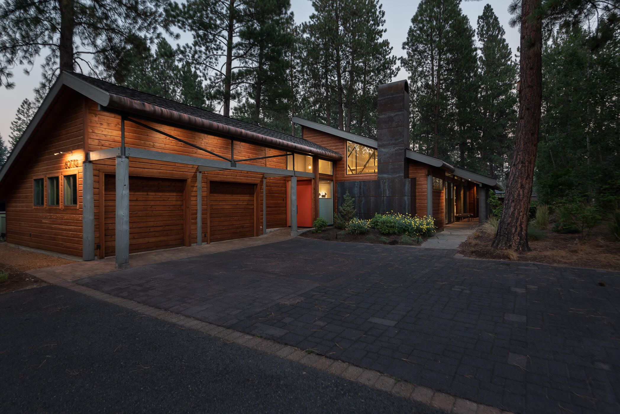Golf course views, birds chirping, and ponderosa pines are just a few natural elements to be enjoyed from back of this unique property in Widgi Creek. Situated on just over a third of an acre, this stunning modern single-level home features an open floor plan with 3 bedrooms, 2.5 baths, exposed beams, custom fireplace, and climate-controlled glass and steel wine cabinet. Interior amenities include Wolf range with commercial hood, two Miele dishwashers, wide combo refrigerator/freezer, and stainless steel kitchen island. Amenities include plenty of storage with 2 car garage and a large mud/utility room and bonus utility room, A/C and many windows to soak in natural light. Outside enjoy a fenced paver patio with a custom kitchen constructed of steel with cement countertops and side patio with golf course views. Located on the way to Mt. Bachelor with easy access to skiing, Deschutes River, hiking, biking & Good Dog Park.