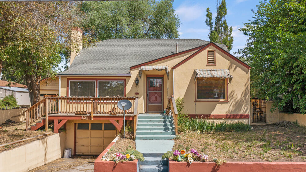 This 2 bedroom 2 bath home has two garages plus a hobby room with covered patio. Bathroom has had some updates. Home has new hot water tank installed 2020, New Refrigerator 2018, there is a shower stall plumbed in the basement 
. Home offers hardwood floors and built-ins in Dinning Room. Property has access off Oregon Ave and off Prescott. See Docs for clear pest and dry rot.