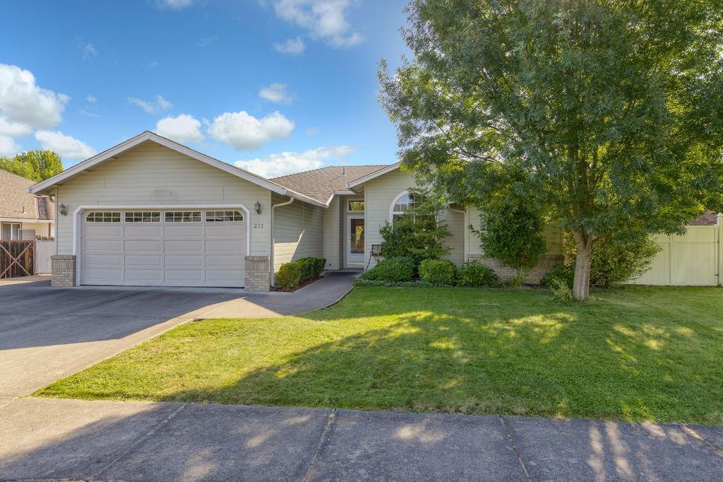Incredible home, in Central Point's desirable Jackson Creek Estates, located in a great cul-de-sac. This home features an open floor plan, 3 bedrooms, 2 bathrooms, 1375 sq ft, built in 1991 & has many upgrades throughout. Living room with large windows, spacious dining area, hand-scraped oak hard wood flooring, upgraded lighting & ceiling fans. Wonderful kitchen offers granite countertops with granite backsplash, under mounted sink with upgraded oil rubbed bronze plumbing fixtures & great appliances. Split floor plan with the master suite on one side of the home and the additional bedrooms and extra bathroom on the other side of the home. The master suite has a walk in closet & vaulted ceilings, attached master bathroom with double sinks, large shower, heated flooring & cabinetry. Travertine floors in both bathrooms& laundry room. Super sweet .21 of an acre lot w/ covered back patio, mature landscaping in both front & back yards w/ timed sprinklers & garden. RVparking. Move-in ready.