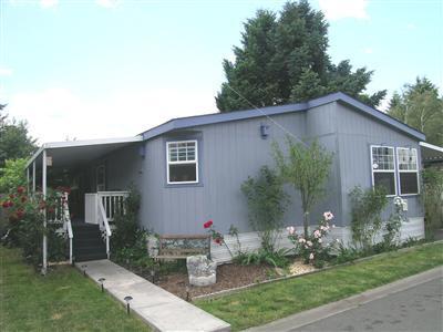 In Park - Must have current DMV License to show and sell. This home is made for comfortable family living. Inside you will find 1600+ sq. ft. w/3 bedrooms, 2 baths plus a den currently used as a bedroom. The kitchen was remodeled several years ago w/beautiful real wood cabinets to the tune of $11,000. The kitchen has a pantry, large two-level island w/eating space for 6 or use large adjacent dining area. There is permitted parking for 4 cars on lot & a 10' x 16' TWO STORY storage building for room needed for all extra recreational toys. Bear Creek Trail is only a block or two away.