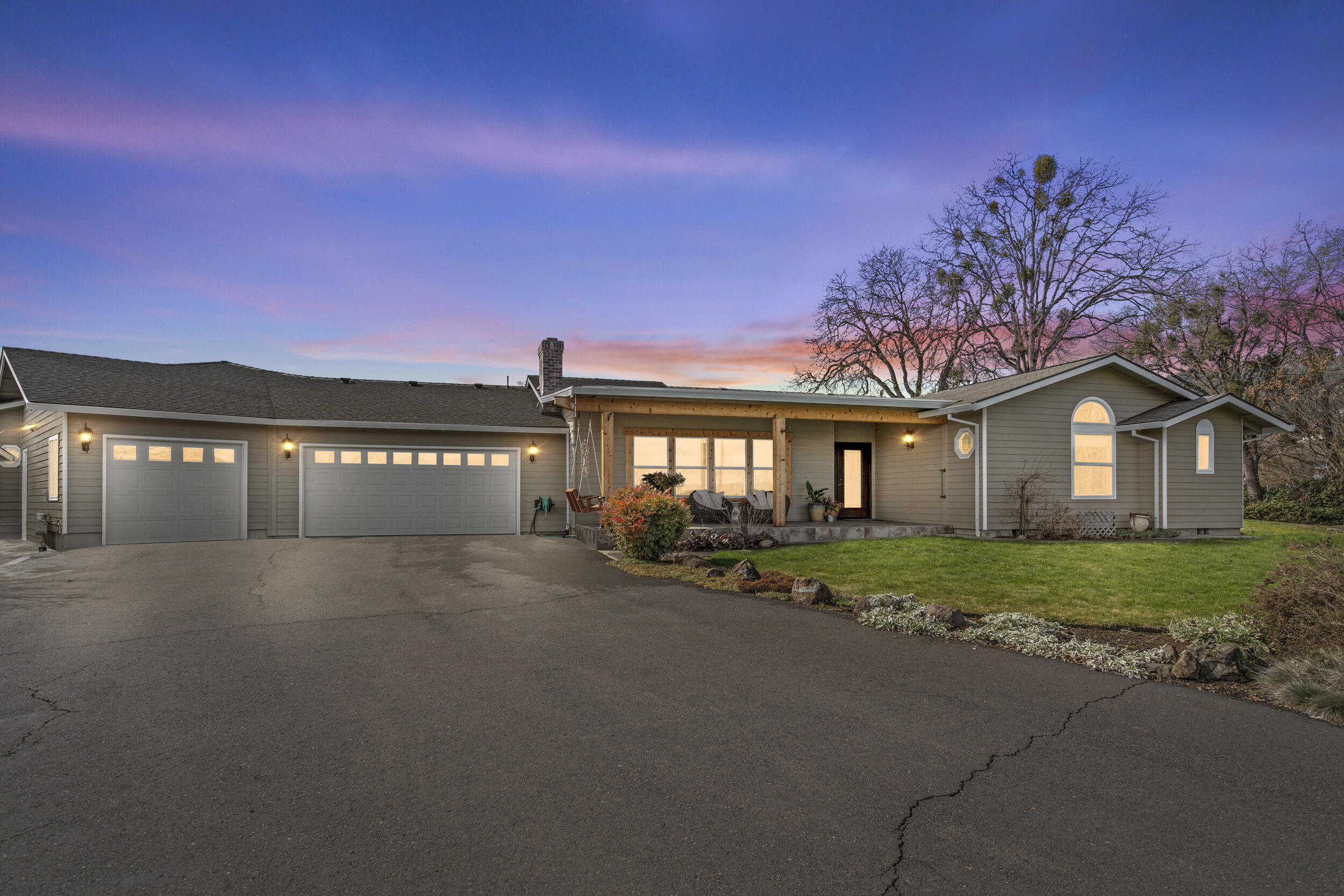 Nestled on 3 ultra-private gated acres, this exquisite multi-generational home offers a perfect blend of modern updates and serene, spacious living. Featuring three master suites, each with its own private bath, this home ensures ultimate comfort and privacy for all residents. Multiple living spaces are designed for relaxation, entertaining, or working from home. The newly renovated kitchen boasts sleek countertops, high-end appliances, and ample storage, making it a dream for any home chef.
Step outside to enjoy a beautifully landscaped yard, complete with a built-in outdoor barbecue, perfect for alfresco dining and gatherings. Take in the stunning views of the Table Rocks and Mt. McLaughlin, and unwind in the outdoor hot tub, an ideal spot for relaxation.
Outdoor enthusiasts will love the barn and fenced pastureland with water rights, making it perfect for horses or small livestock. A large garage offers abundant space.
This property offers endless potential!