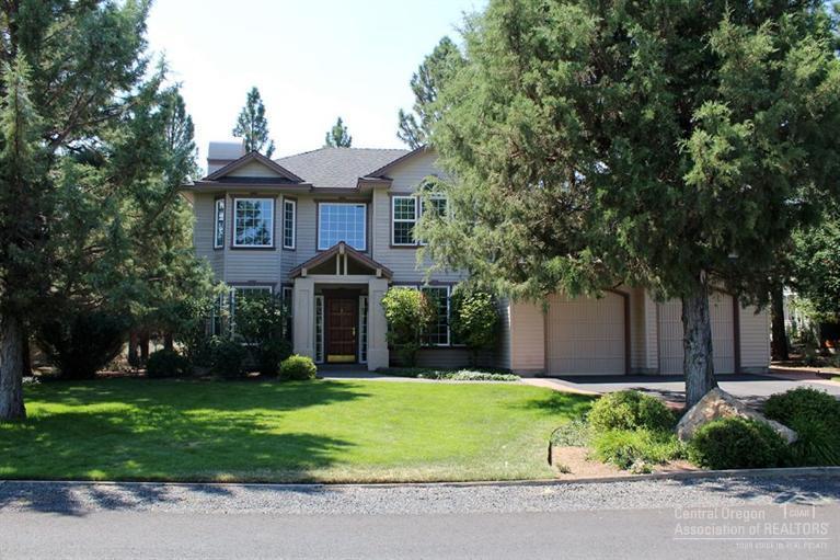 Desirable Rivers Edge Village offers large wooded flat lot & deck w/pergola for entertaining. Great room concept w/slate surround fireplace & bamboo floors. Cherry kitchen cabinets/bamboo floors + granite counters/snack bar/walk in pantry & double Kohler sink.Informal dining rm w/3 bay windows overlooking pvt backyard.Double attached garage w/workshop.Upper level offers 3 bedrooms w/vaulted ceilings & 2 full baths. Mstr bth: tiled floors/counters + lg walk-in shower/jetted tub & dual sinks + walk-in closet.