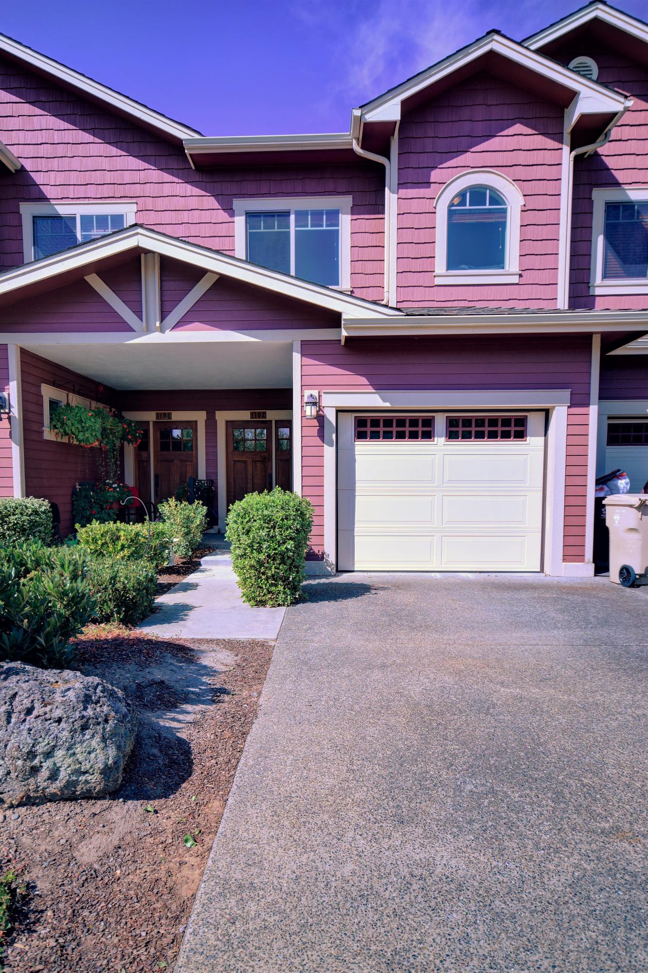 This beautiful townhouse, in a great location within Grants Pass, features  granite counters, hardwood floors and a full appliance package. Both upstairs bedrooms have their own baths as well as a guest 1/2 bath downstairs. Home has an upstairs patio as well as a patio in back downstairs, a finished one car garage and a wonderfully landscaped yard. Sequoia village has a pool, hot tub, clubhouse with pool table and full kitchen, and even workout equipment.