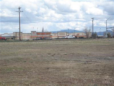 This prime commercial acreage is located directly across from The Home Depot in Redmond. Lot totals 4.28 acres, and there is an option to partition the land into 3 separate lots. NOTE: The three tax lots are to be partitioned off prior to the close of escrow - they do not exist at this time. Approximately 500' of Hwy 97 frontage, three phase power, water & sewer stubbed to site, parcel is level and visible from Hwy 97 bypass , clean Phase I environmental report, Zoned C-1 Strip Service Commercial.