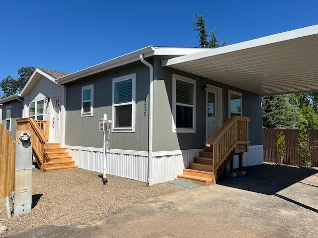 3 months FREE space rent @ approved sale price. Charming Brand-New Manufactured.   Welcome to your dream home in this peaceful 55+ senior park! This manufactured home offers modern construction. Featuring an open concept
layout, this home boasts a bright and spacious living area, perfect for relaxing or entertaining.  The kitchen is equipped with stainless steel appliances, ample cabinetry,
and stylish countertops. The primary suite offers a tranquil retreat with generous closet space, while additional rooms provide versatility for guests, a home office, or hobbies.  Enjoy year-round comfort with a high-efficiency heat pump, ensuring cozy winters and cool summers. Green Building Verification Type: ENERGY STAR Certified Homes.  Outside, you'll find a single-car carport.  Potential Lease option.