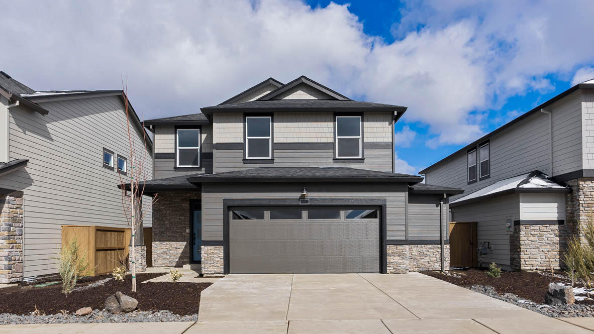 MOVE IN READY! SPECIAL RATE & closing cost incentive with use of builder's preferred lender!!  Must see corner lot home in Bend! Located near Reed Market Rd and Highway 20, where peaceful surroundings connect you to outdoor and city living. This magnificent Porter two-story floor plan has 5 beds, 3 baths, with a bed and bath on the main floor that is ideal for an at-home office or a guest bedroom. The great room has designer features with a fireplace and a floor-to-ceiling painted shiplap wall. The lavish kitchen has beautiful shaker cabinetry, quartz countertops with full tile backsplash, and stainless-steel appliances like a gas range with vent hood, built-in oven, and microwave. The primary bedroom is spacious, it has a walk-in closet, and an en suite bathroom with a double vanity. The hall bathroom adds extra comfort with a double vanity as well. Sales office hours are 10am - 5:30pm daily. Photos are representative of plan, features/specs may vary.