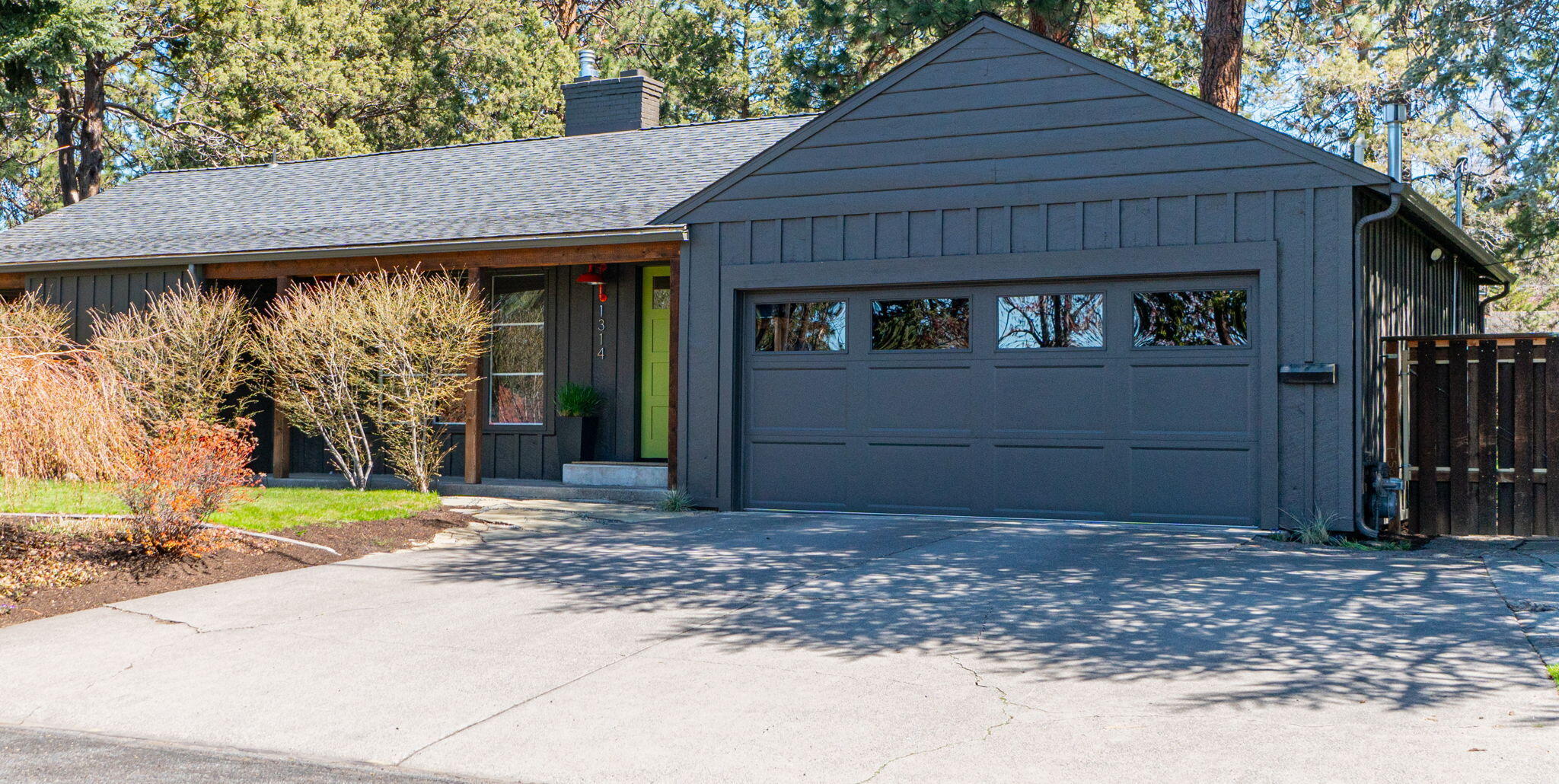 SINGLE LEVEL Mid Century Modern with permitted ADU located in Bend's sought-after Midtown. Offering a total of 2,628 SF (2191 SF in main home and 437 SF in ADU), and sited on a RARE .30/acre lot surrounded by mature foliage, this home boasts timeless finishes and updates throughout and features an EXQUISITE outdoor setting w/expansive yard and multiple spaces for entertaining. Living Room w/peek-a-boo mountain views, gas fp and hardwood floors. Chef's Kitchen features a sleek wall of tiled backsplash, galvanized metal countertops, stainless appl and walk-in pantry. Family Room features a stunning patinaed steel gas fp and opens to Dining area w/access to back deck and patio, blending indoor/outdoor living seamlessly. Private Primary Suite w/generous walk-in closet, and spa-like bath w/Quartz vanity, soaking tub & tiled shower. 2 additional BR + full BA. CHARMING ADU overlooking the back gardens w/full kitchen and BA. Close to parks, schools, & Downtown/Midtown dining & shopping.