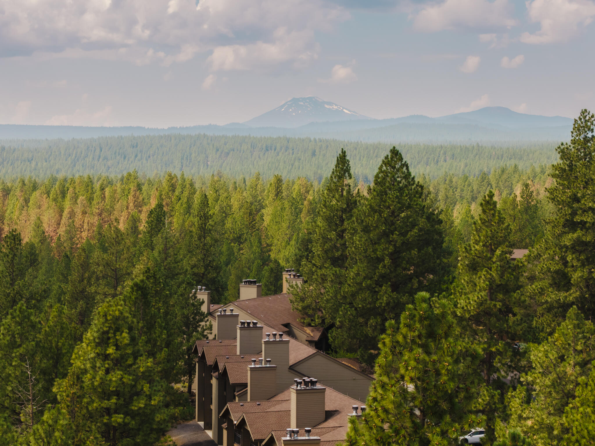 Sold fully furnished! Just minutes from Mt. Bachelor, this fully furnished STR-approved condo is the perfect mountain retreat, vacation rental, or full-time home. Enjoy warm rustic finishes, a cozy fireplace, an updated kitchen, and a private deck with peaceful forest views. The resort offers year-round amenities including heated pools, hot tub, sauna, fitness center, tennis & pickleball courts, ice skating, mini golf, on-site dining, and direct access to the Deschutes River Trail. HOA dues cover utilities, exterior maintenance, insurance, and all resort amenities—making ownership easy and stress-free.