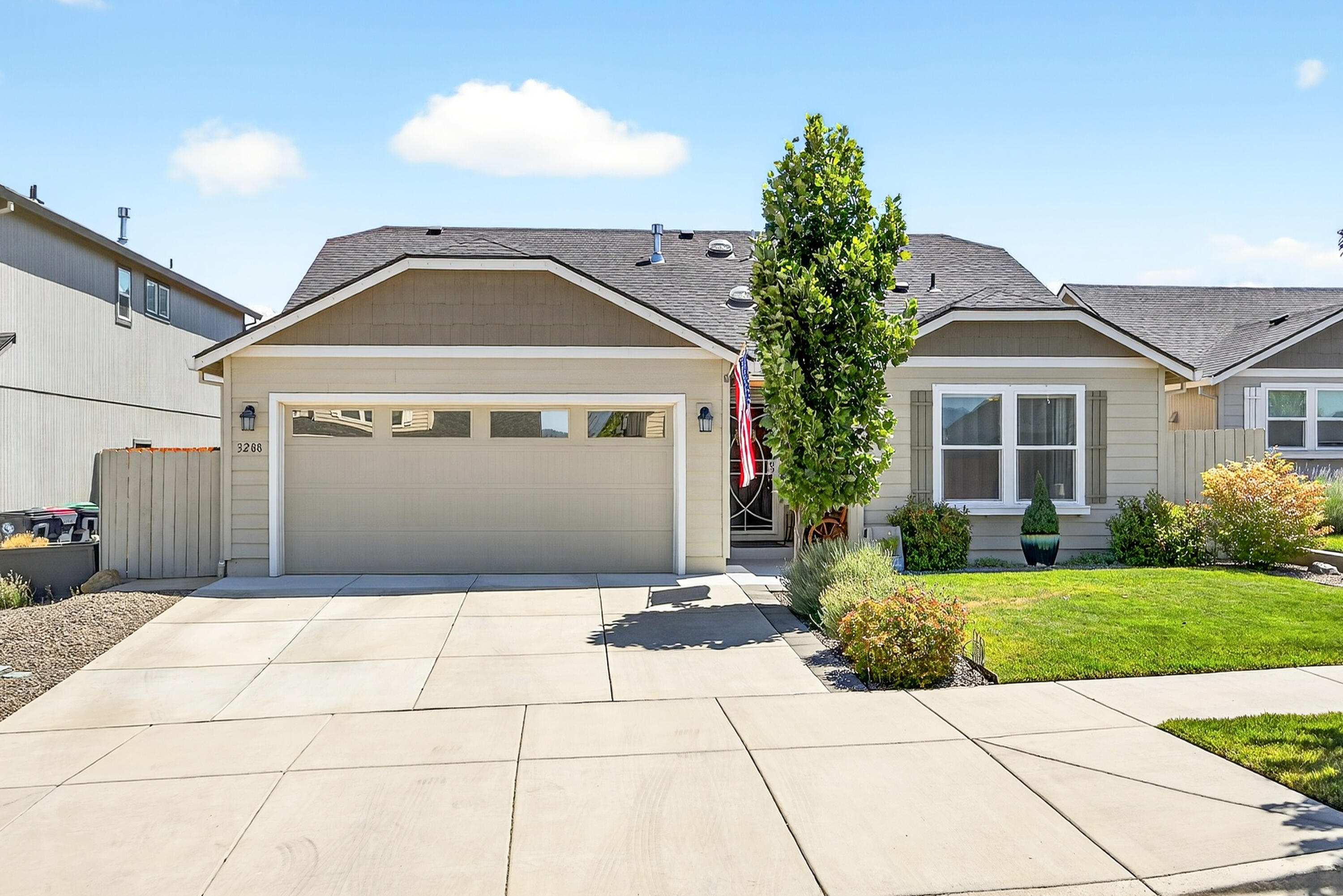 Beautiful 2019 single-level home in a desirable NW Medford neighborhood of newer homes. This split-bedroom layout offers an open-concept living space with engineered wood flooring and carpeted bedrooms. The kitchen features a gas stove, large eat-in island, ample counter space, and flows seamlessly into the spacious living and dining areas. The private primary suite includes dual vanities and two walk-in closets. Two additional bedrooms—one with French doors—offer versatility for guests or a home office. Enjoy a beautifully landscaped, low-maintenance fenced yard and a covered back patio. Oversized garage provides additional storage or workspace. Move-in ready!