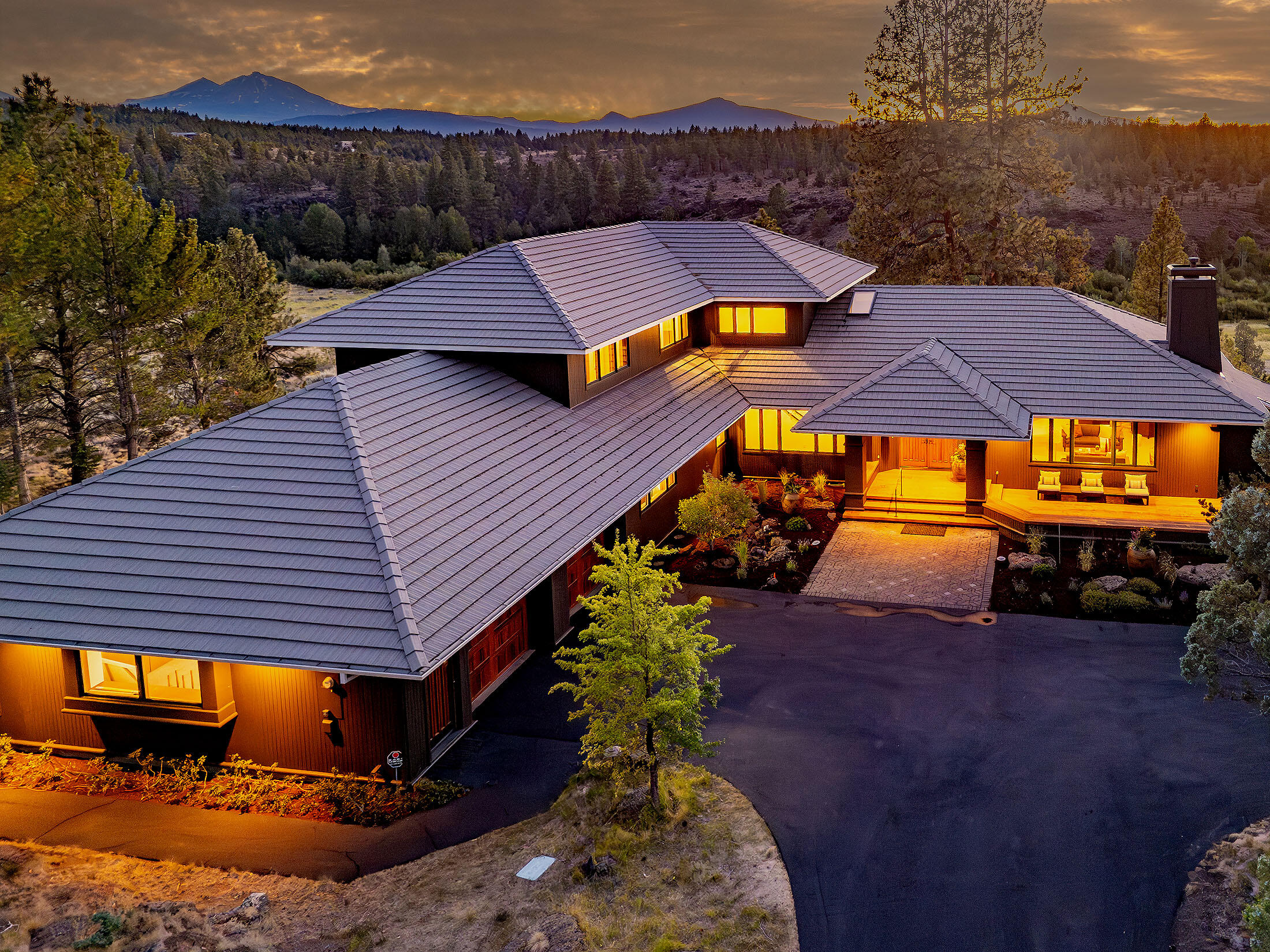 A masterpiece of design and craftsmanship, this extraordinary Sisters estate—conceived by acclaimed architect Steve Van Sant and brought to life by Tee Harbor Construction—delivers an unparalleled lifestyle in one of Central Oregon's most coveted settings.Perched on The Rim at Aspen Lakes, the property commands jaw-dropping panoramas from Mt. Jefferson to Broken Top. Beyond its borders lies permanently protected land, offering a front-row seat to Whychus Creek and the pristine Willow Springs Preserve. Inside, walls of glass frame breathtaking scenery, a sculptural fireplace anchors the great room, and the chef's kitchen boasts professional appliances, a walk-in pantry, and an island. The main-level primary suite is a serene, light-filled retreat. From the deck, watch raptors soar and deer roam—all just minutes from downtown Sisters and Aspen Lakes Golf Course. This isn't just a home; it's a front-row seat to the majesty of Central Oregon.