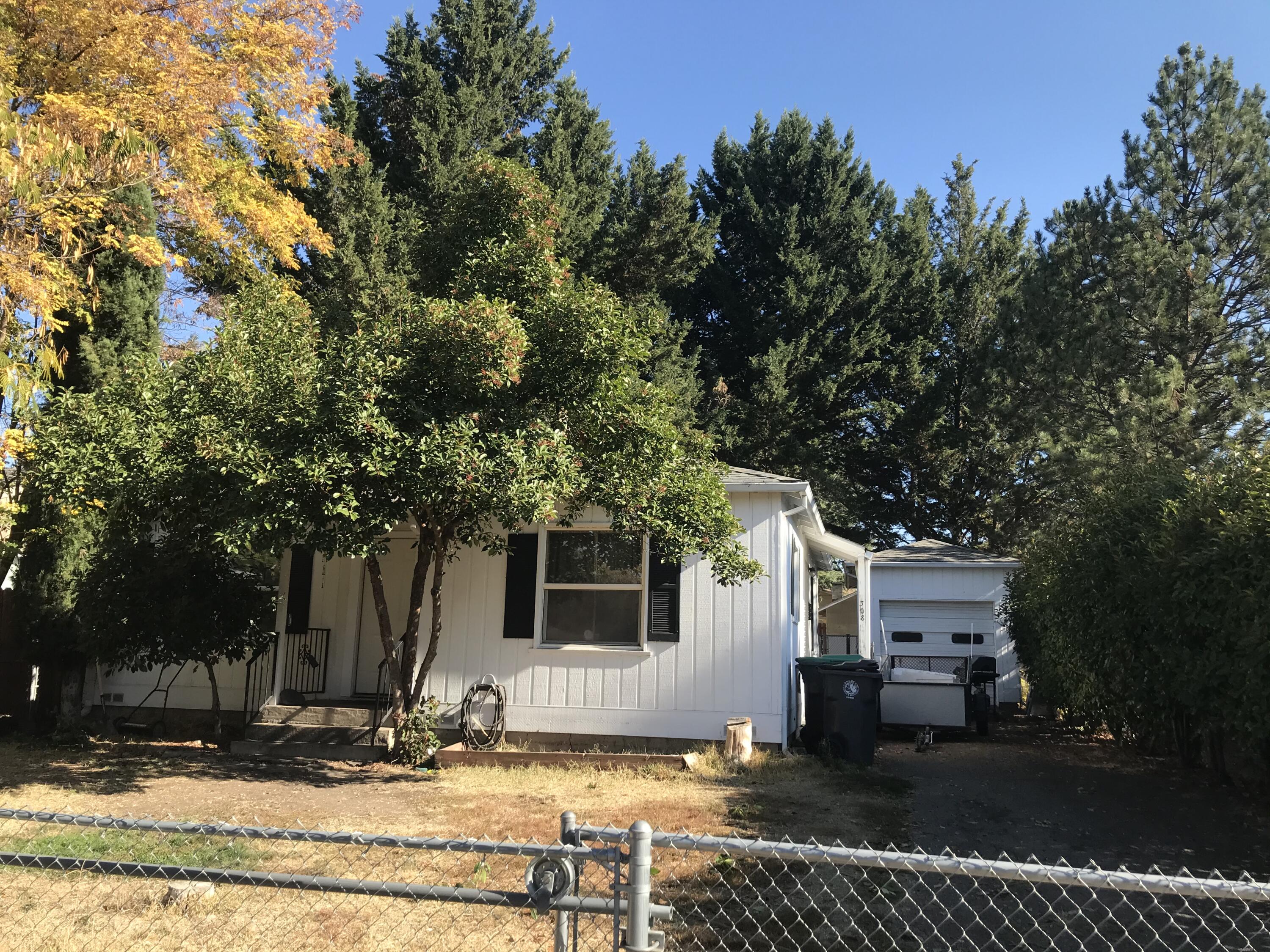 Check out this great first time home buyer or investment opportunity, won't last long! Close to shopping, bus lines, schools and more!  Light and bright with all double-paned vinyl windows. Two nice-sized bedrooms. Spacious kitchen with lots of cabinets and dining area. Large living room with big windows. Inside laundry room includes storage area and cabinets. Detached garage with auto opener and long driveway for additional off-street parking. Large fenced back yard with alley access.