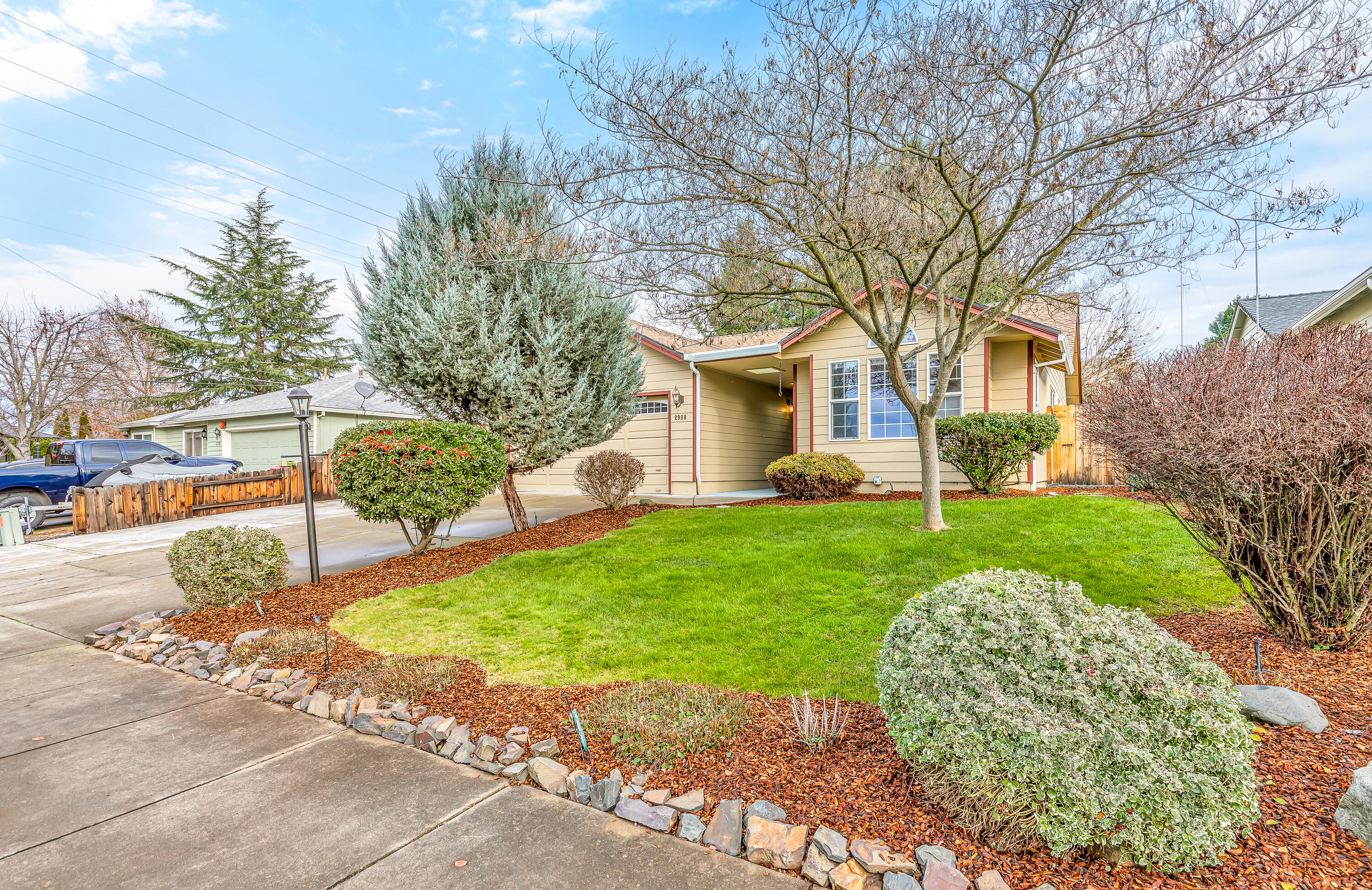 Welcome to East Medford's epitome of charm and comfort! This well maintained single-story home features 1,804 sq ft of living space with 3 bedrooms and 2 bathrooms. The sellers are generously offering a $10,000 buyer credit, a golden opportunity for buyers to ease their closing costs or explore mortgage rate buy-down options. Step inside and be greeted by a
warm and inviting living room, seamlessly flowing into a spacious dining area, providing versatile spaces for relaxation and entertaining. The kitchen includes stainless appliances. Relax in the additional family room with a cozy gas fireplace. Outside, the property exudes curb appeal with well-maintained mature landscaping, creating a private oasis. The low-maintenance yard includes sprinklers and an outdoor patio. The home also includes an attached 2-car garage and extra paved parking on the front and side of the home.
Don't miss the chance to call this East Medford home your own!