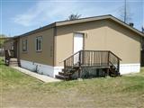 There are 2 manufactured homes both legal. One had been detitled and is attached to the real estate, the other has not been detitled. Both units are clean up and re modeled nicely. Unit #7816 is a 1990 double wide with 1,296 SF and Unit #7818 is a 2003 double wide with 1,860 SF. Great opportunity for the investor or for a multi-family set-up. Large set back lot for all your toys or equipment. Both homes have all new painting, carpets, vinyl flooring, some new vinyl windows, new cabinets, new light fixtures, new bathroom fixtures, natural gas to property.
