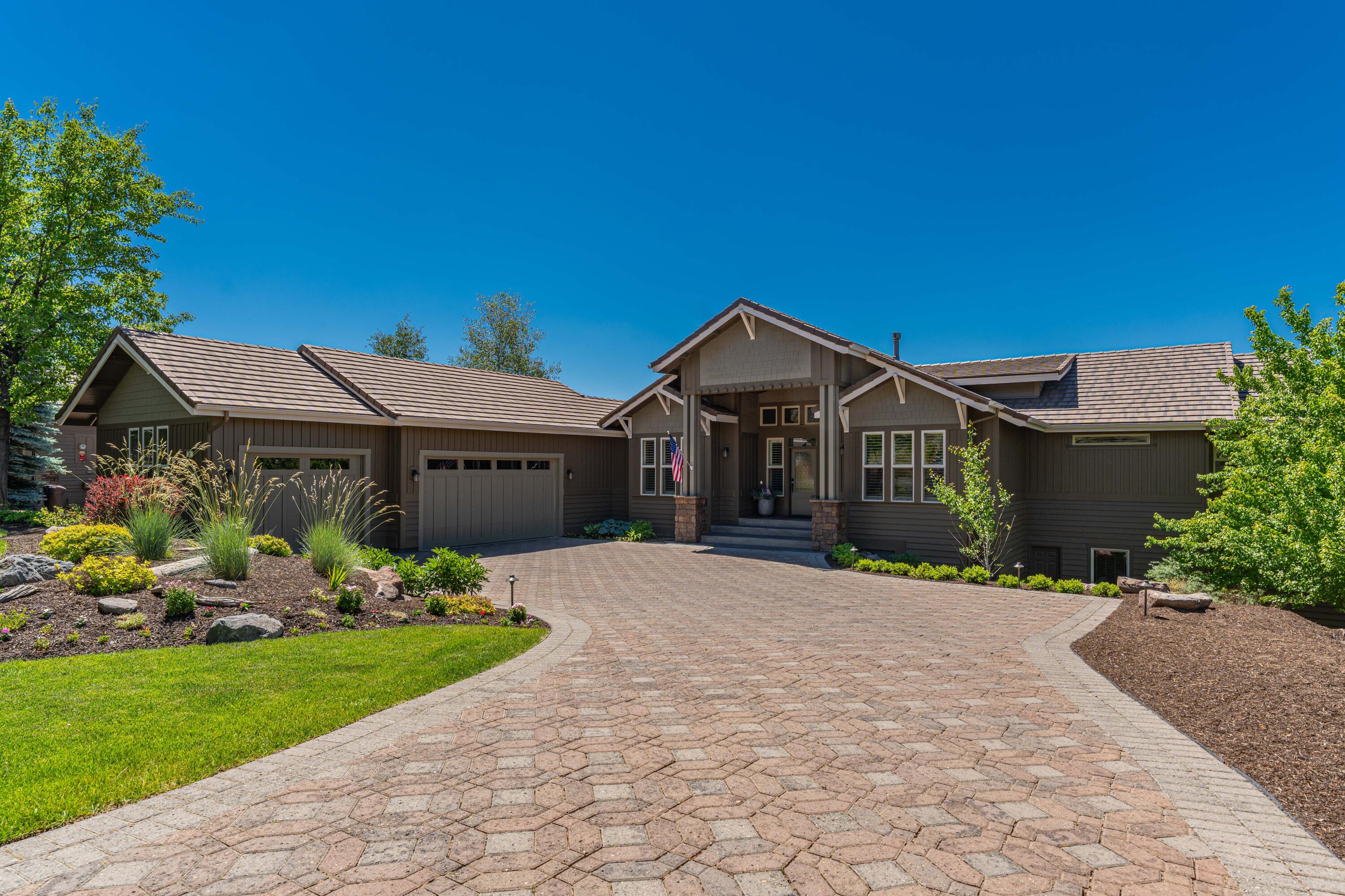 Immerse yourself in luxury with this spacious masterpiece in the prestigious westside neighborhood of Skyliner Summit. This meticulously remodeled home boasts breathtaking Cascade Mountain views & offers the perfect blend of sophisticated design & unparalleled comfort. Step inside the stunning great room, where soaring ceilings & a completely remodeled gourmet chef's kitchen create a light-filled, open masterpiece. Each of the four spacious bedrooms is a private sanctuary, complemented by luxurious bathrooms. A custom movie theater guarantees unforgettable movie nights. The spacious private office can also be a 5th bedroom. Unwind under the high-end tile roof with inviting covered porches. A retractable awning on the back porch allows for year-round entertaining. Additionally, a dedicated workout room allows you to maintain your fitness routine in the comfort of your own home. The network of trails weaving throughout the neighborhood offers a seamless connection to the outdoors.