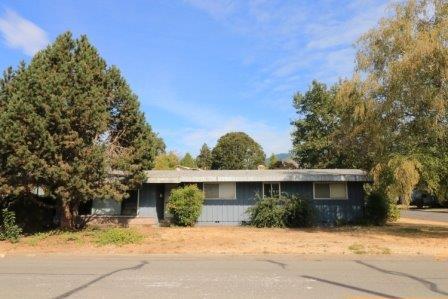 Opportunity knocks and it needs a makeover! This home is being sold as is and will need lots of work to call it your own, flip it, or rent it! This spacious 1770 square foot, one story, 3 bedroom home has classic lines and a great floor plan with living room, family room, dining area and open kitchen. In the heart of town on a big corner lot with all city services, close to schools, shopping and easy access to I-5. Cash buyers only please.