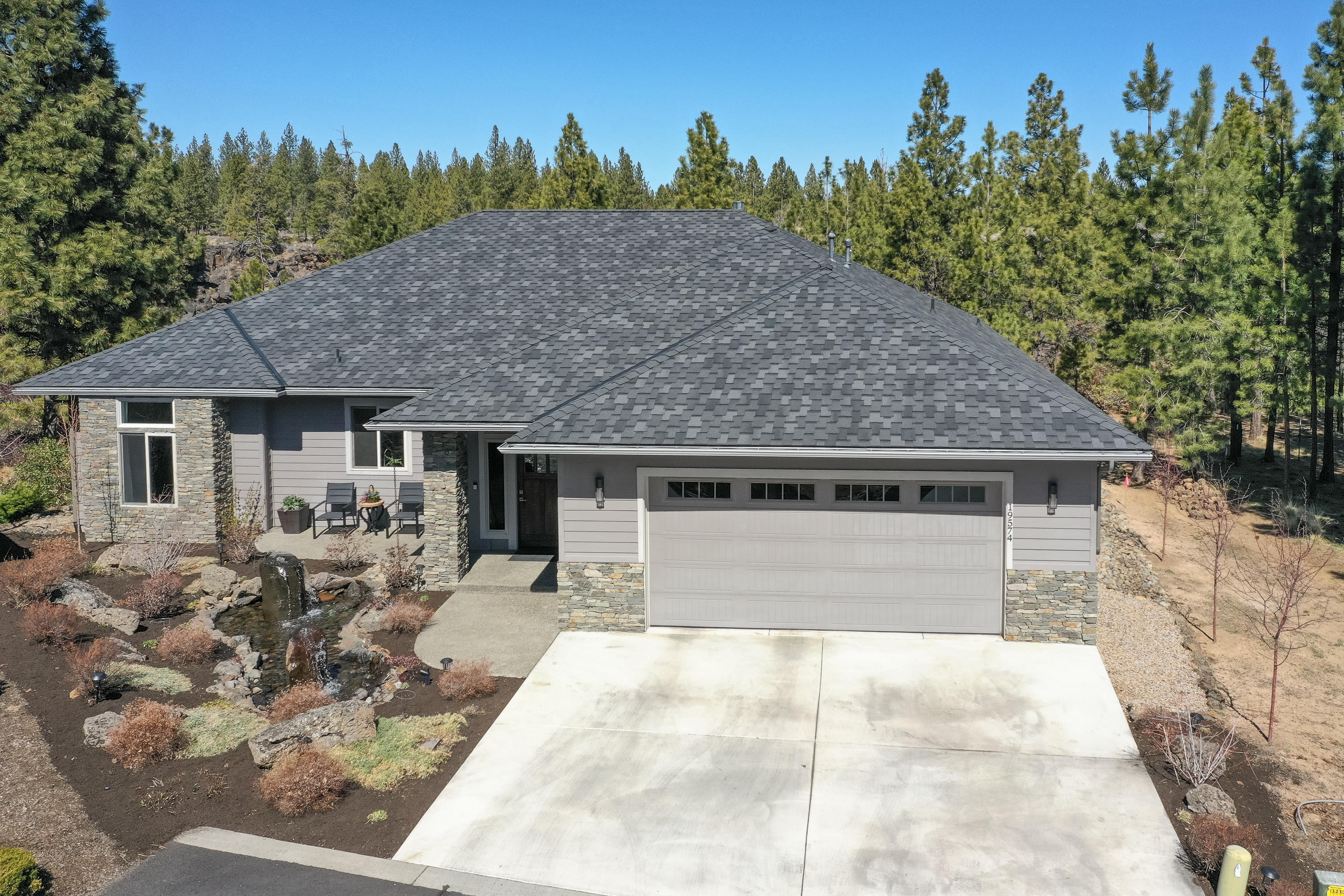Enjoy the incredible Canyon views from this custom-built home in SW Bend. This gorgeous thoughtfully laid-out, single-story home greets you with a spacious great room that includes tall ceilings and a full wall of windows. The open kitchen has a beautiful oversized island to entertain many or, for lots of room as you create a culinary delight. The home has a large primary bedroom with pretty views and coffered ceilings, private bathroom with two separate vanities, tile shower, and large walk-in closet with custom built-ins. Two additional rooms, one with a Murphy bed, can be bedrooms or offices. Beautiful outdoor living space with outdoor heaters, and covered stamped patio to enjoy all year long. 170 feet of canyon frontage, a beautiful spot to sit and enjoy a cup of coffee and the view of the river among the tall trees. The community amenities include a pool, pickleball/tennis courts, a fitness center, and community space, three blocks to river access. Welcome Home!