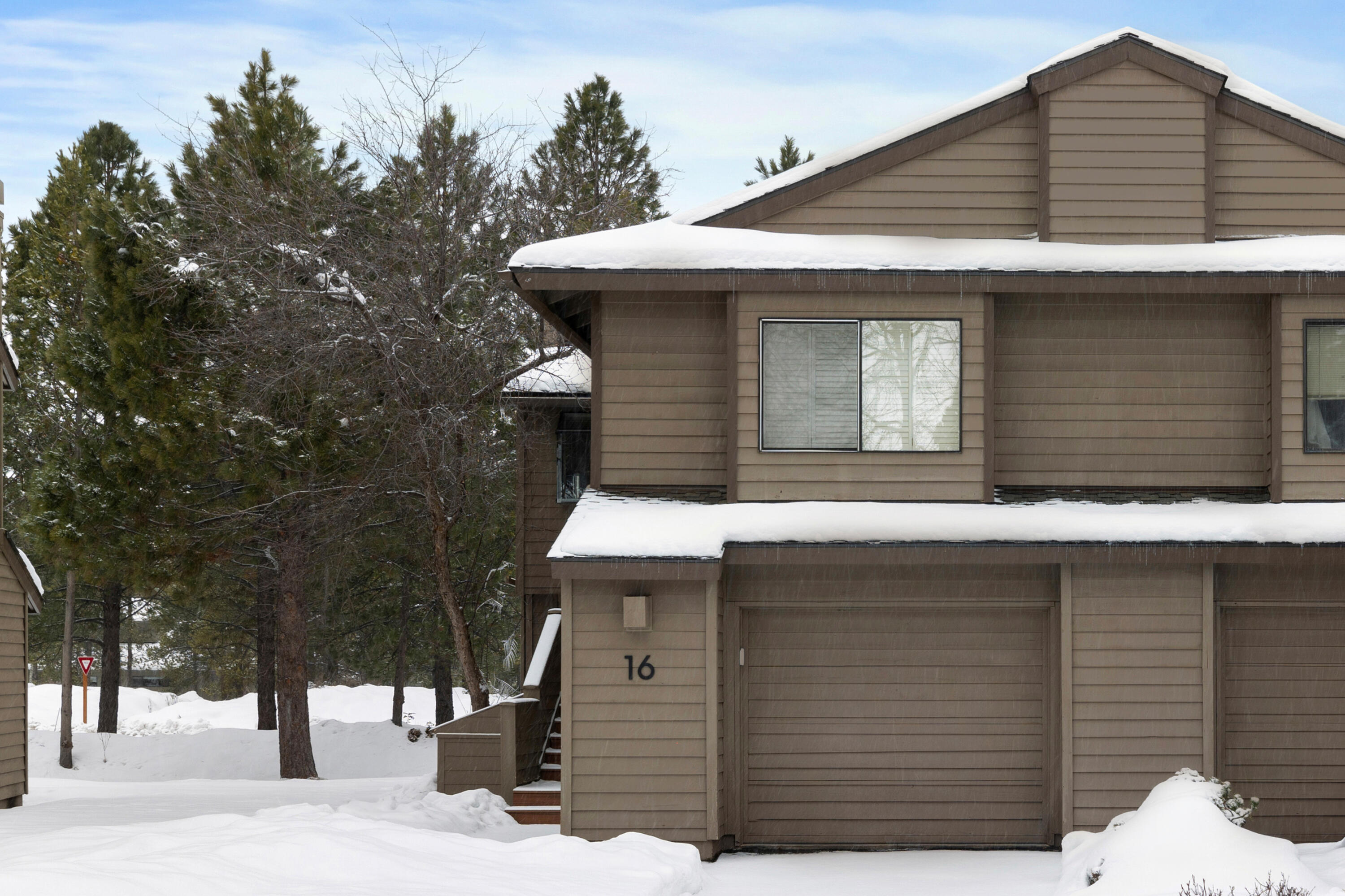 $5,000 Seller Credit! Turn-key and fully furnished Fairway Village condo with a proven track record as a successful Airbnb and VRBO rental, Premier Host with excellent reviews! This Sunriver retreat features vaulted wood ceilings, a cozy wood-burning fireplace, and an open-concept great room. Enjoy outdoor living on the private balcony, patio, and hot tub. The main-level primary suite offers separation from two guest bedrooms and a full bath downstairs. Recent upgrades include newer appliances, gas furnace, central A/C, refinished deck, and EV Level 2 charging in the garage. Located near Woodlands Golf Course, Deschutes River, Cardinal Landing, and National Forest trails. Ideal as a full-time residence, vacation home, or income-producing investment. Rental history available upon request.