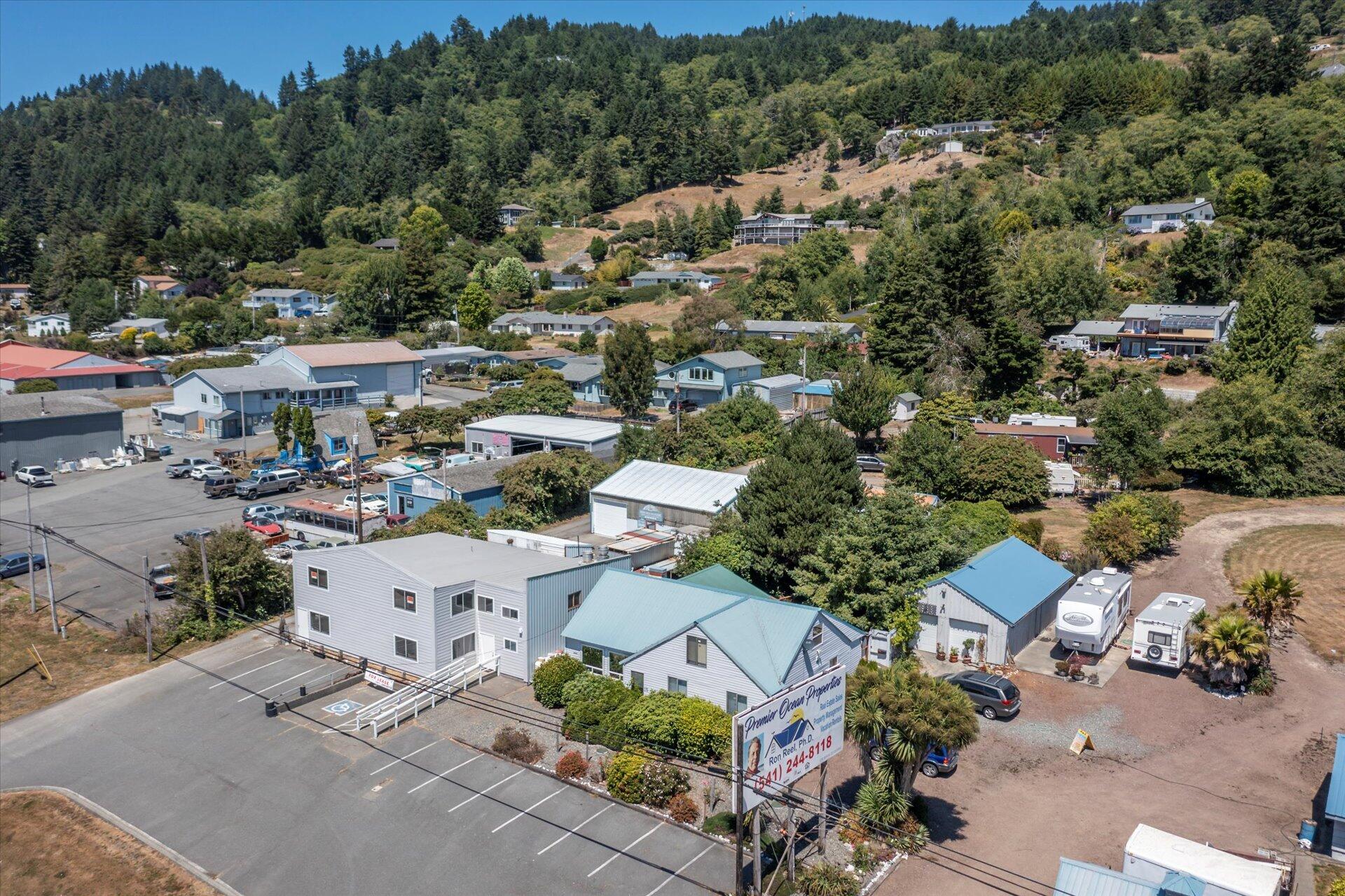 Discover nearly two and a half acres of prime, commercially zoned property at the South end of beautiful Brookings, Oregon. This versatile land includes two stick-built homes, a spacious 2000+ sqft restaurant, garages, a former cannery building, two small retail buildings, and three RV rental spaces. With high-exposure road frontage on historic Highway 101 and the Pacific Ocean just a stone's throw away, this property offers exceptional visibility and endless possibilities. Zoned for multi-housing, an RV park, retail, restaurant, or hospitality ventures, it's the perfect spot to expand your current business or launch a new endeavor. Don't miss this rare opportunity to create your dream enterprise in a stunning coastal setting!