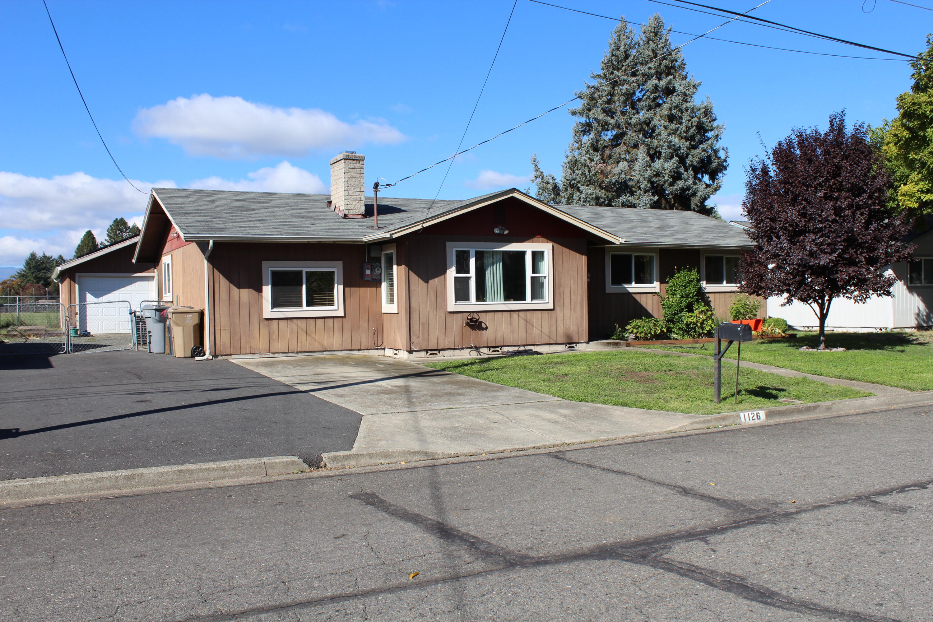Adorable Starter or empty nester home with endless potential. An incredible opportunity awaits with this affordable and adorable starter home. Home has a living room and family/rec room, three bedrooms, nice pantry/laundry room with lots of storage. Big yard that backs up to Parkside Elementary school, back covered patio, room to garden, great play are for kids. Has a 2 car garage/workshop, extra parking for your RV or boat. While comfortable and move-in ready, this residence offers a blank canvas for you to infuse your own personal style. The simple floor plan is highly functional with great bones and an unbeatable location close to everything.