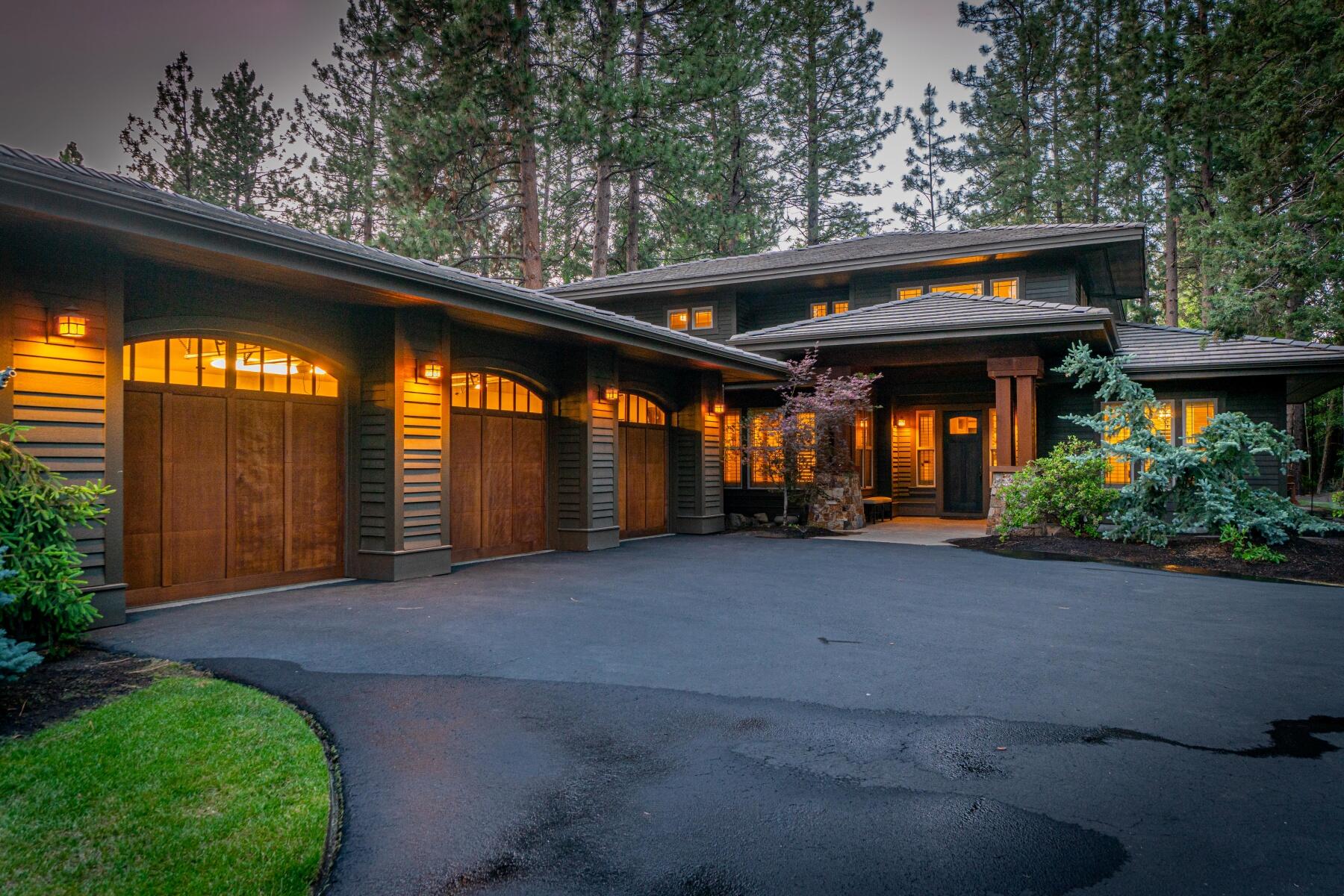 A tasteful, timeless craftsman home that epitomizes quiet luxury - tucked on a secluded street of Bend's prestigious Broken Top community. Universally appealing for its layout and tasteful finishes, this home includes a primary suite and second suite on the main floor along with an office, mudroom, laundry, formal dining, and wonderful access to outdoor living. The spacious kitchen is a chef's dream, featuring a double island, sueded granite countertops, stainless steel appliances, a corner pantry, and ample storage space. The primary suite is a true retreat, complete with a luxurious en suite bathroom and walk-in closet. The second floor includes two additional bedrooms, full bath and bonus/flex room. 
Enjoy the beautiful Central Oregon weather on the expansive paver patio with a built-in kitchen, fire pit, and hot tub, making it a perfect home for entertaining or just enjoying the serenity of Broken Top.