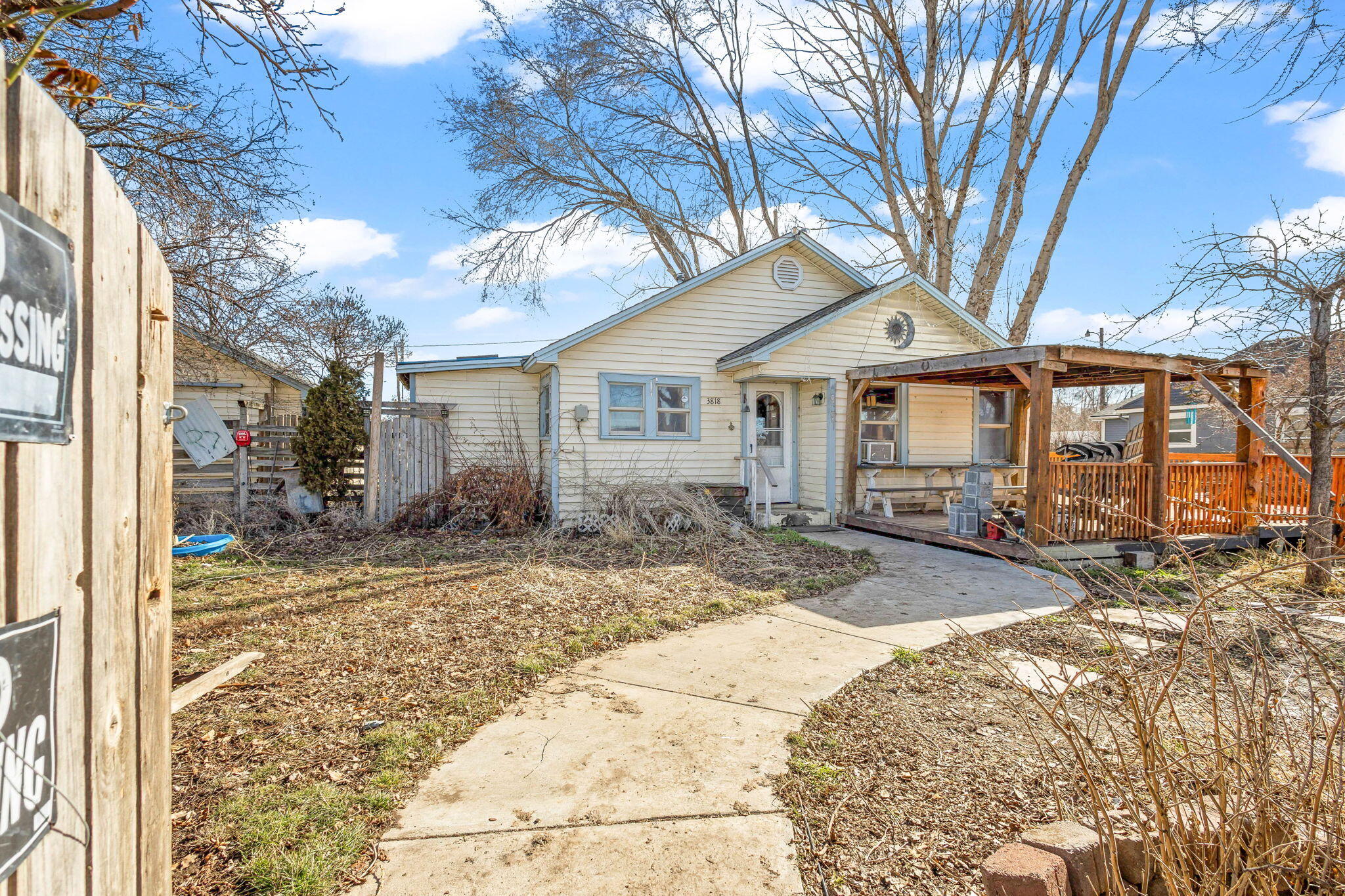 Here is your chance to bring your tools and creativity to this charming 1940 fixer upper. This home is a 2 bedroom 1 bath home with hardwood floors, fireplace with built-in
features, eat-in dining room, and vintage kitchen. Some updates have been done over the years including vinyl windows & siding, french doors, and covered front
porch/deck. Large .25 acre lot, fenced and gated with wood shed, back porch for entertaining, detached garage, multiple fruit & elm trees, and plenty of space for a garden.