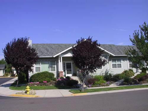 55+ Living at it's Best! New carpet! Hardwood floors, custom built-ins in living room and den/study. Lovely built-in hutch in dining area. Jetted tub in 2nd bath. Steam shower in master bath. Large closet in master suite is bamboo with cedar lining on edges. Crown molding accents this lovely home too. Gas range in kitchen, breakfast bar and lots of cupboard space. Attached one car garage with extra storage. Retractable awnings on the front of the home powered from switch inside. Corner lot with association maintained landscaping and partial mountain views. A must see property!!