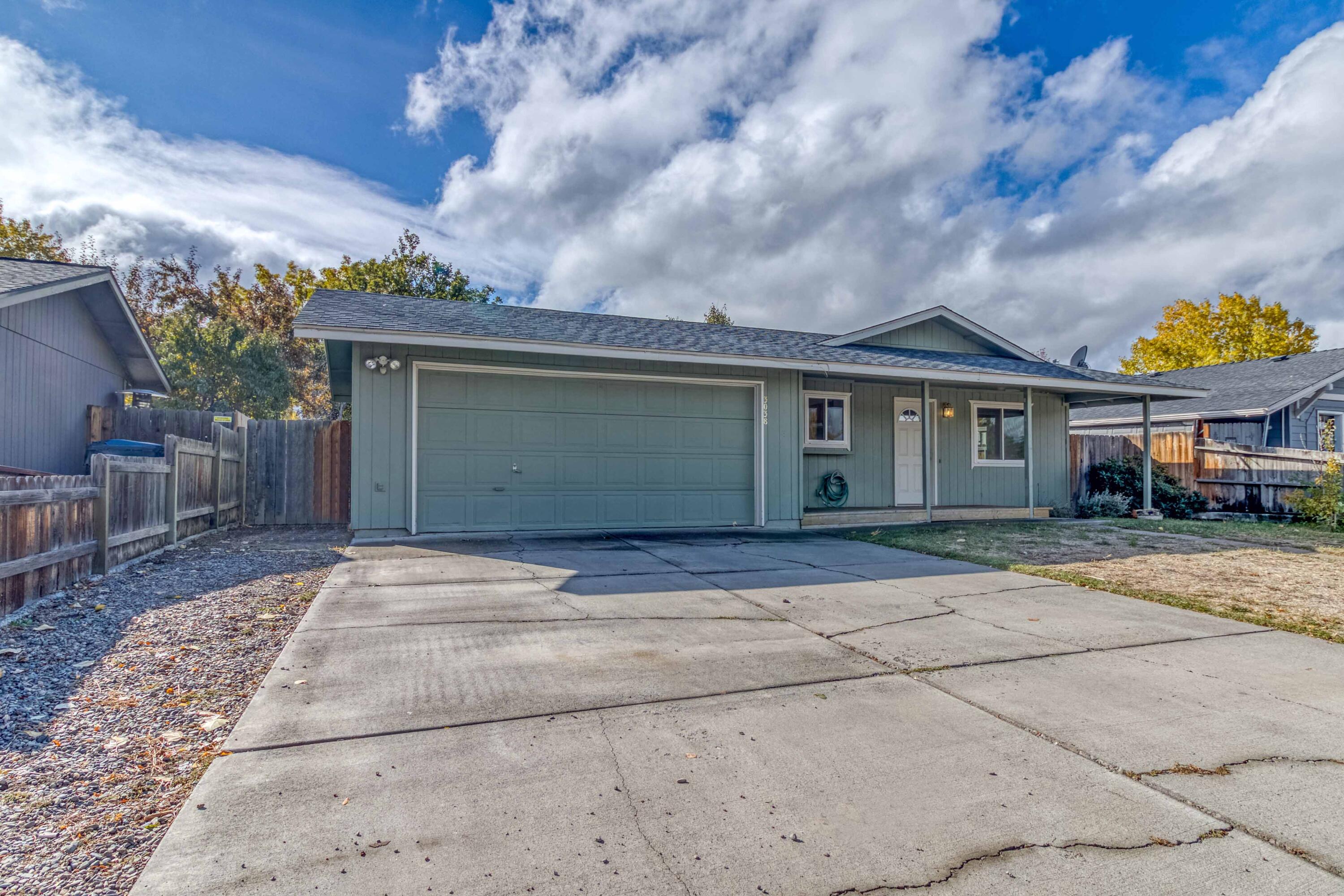 Traditional single level home, 3 bedrooms and 2 baths. Owned solar panels supply power for 2 mini split units for heating and cooling. Large kitchen with additional counter space with added IKEA butcher block and steel cabinetry. Room for dining area in the kitchen. New lighting fixtures and kitchen and bath faucets. Covered front porch has been expanded. Large back deck off sliding glass doors. Backyard is fenced and divided into garden space with 10 raised beds and drip system, established grapes, herbs, lavender, hops, and berries. Not as vibrant in the fall but Spring will be lovely! Two car garage with shelving for storage. Very clean and ready to move in. House is located in close proximity to Quartz Park, dry canyon trails, and a neighborhood park with a large playground. The new Redmond Recreation Center (currently under construction), to be completed early 2026 is located within .7 of a mile on 35th and Lava.