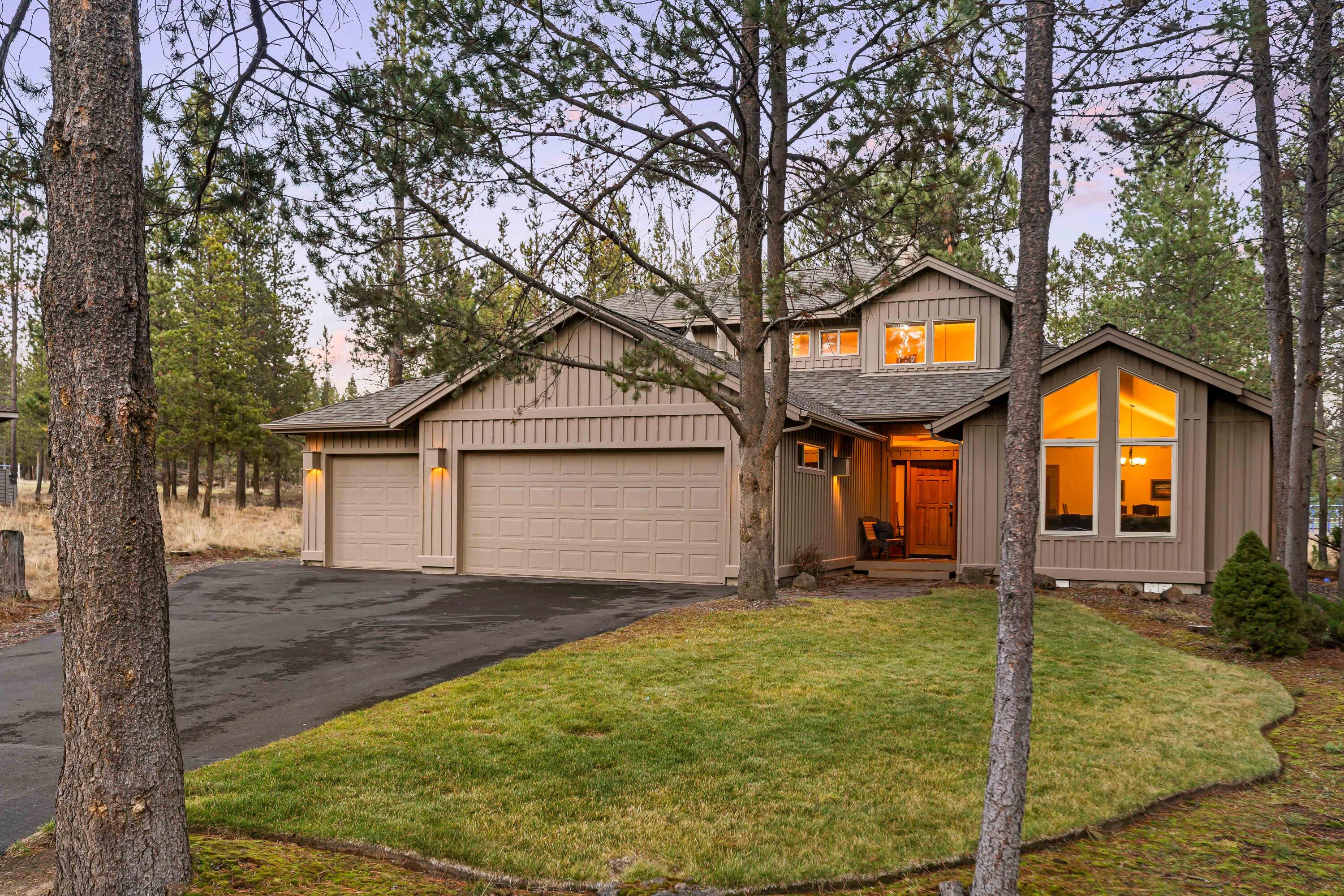 Welcome to 9 Hoodoo, a spacious 5-bedroom home offering the best of Sunriver living, located near the desirable Fort Rock Park. The main level offers a primary suite with views of the beautifully landscaped, fully fenced backyard, along with an additional guest bedroom. Enjoy the cozy fireplace on cool evenings in the spacious living room with vaulted ceilings and cathedral windows. A second living area offers a full-wall entertainment center, built-in bookshelves, and additional seating. The chef-inspired kitchen features a central island, granite countertops, stainless steel appliances, and hardwood floors. Upstairs, three additional bedrooms provide comfort and style for your guests. Outdoors, the backyard includes a paver patio, and new hot tub, perfect for relaxation. Additional highlights include A/C, a 3-car garage with extra storage space for your gear.