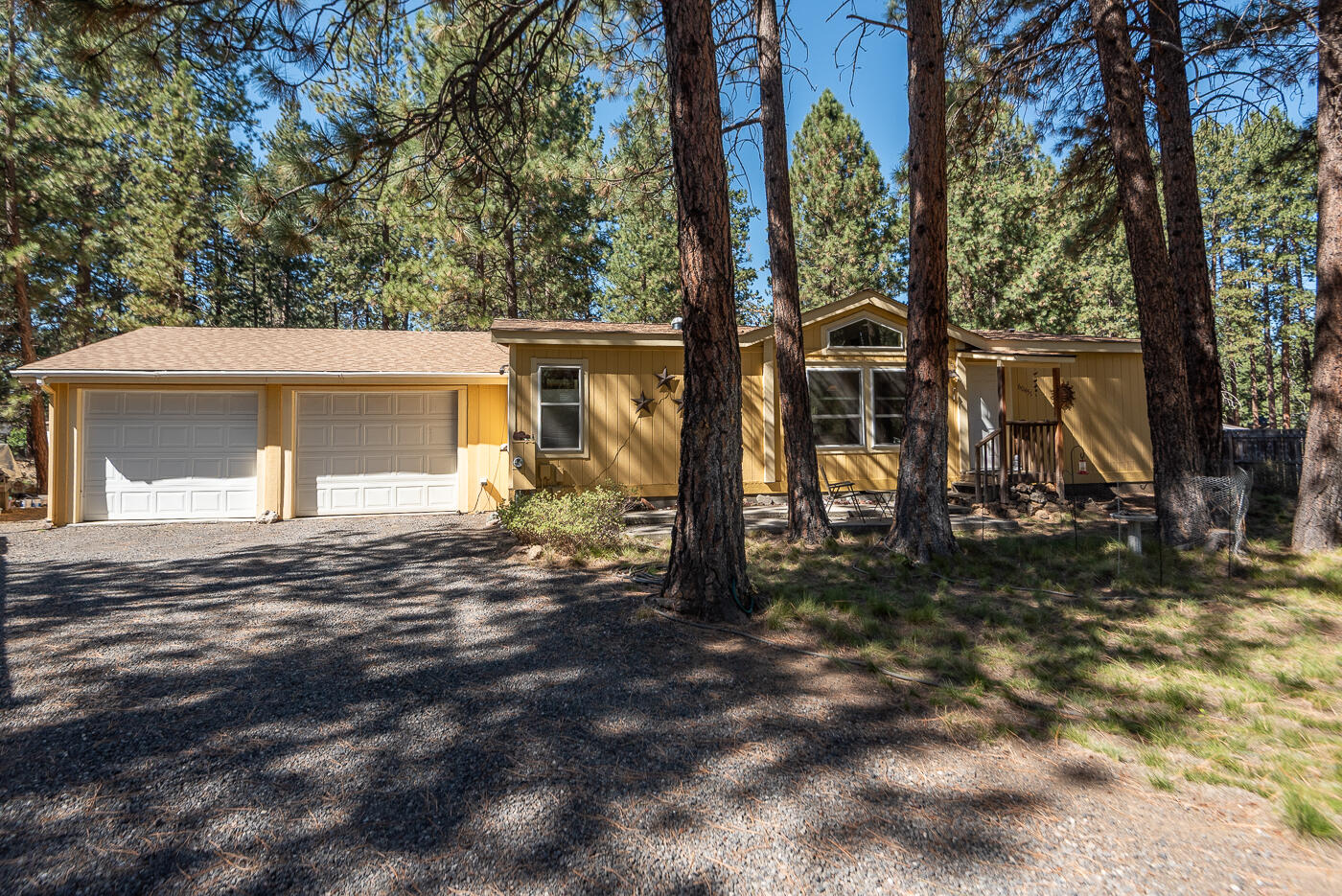 Peaceful enjoyment... quiet serenity... the quintessential Bend lifestyle is yours now. Imagine sitting by the seasonal canal, watching the wildlife all around you, star gazing from your hot tub listening to the breeze in the trees... tinkering in the oversized 676 sf garage... enjoying sunrises & sunsets from your living room and dining room. For the first time since placed, this home is now available... beautifully maintained with a newer roof (2023), freshly pumped and inspected septic system, included snow blower for those winter months & a low maintenance yard (once a year mowing) giving you more time to play on the lakes, rivers and trails. Located near the entrance to Deschutes Riverwoods, this home & land is the perfect way to enjoy all that Bend has to offer with easy access to Bend, Sunriver and the Cascades Lakes, the Old Mill & downtown Bend. A marvelous floor plan with separation of bedrooms, vaulted ceilings & large windows, this is a truly remarkable place to call home!