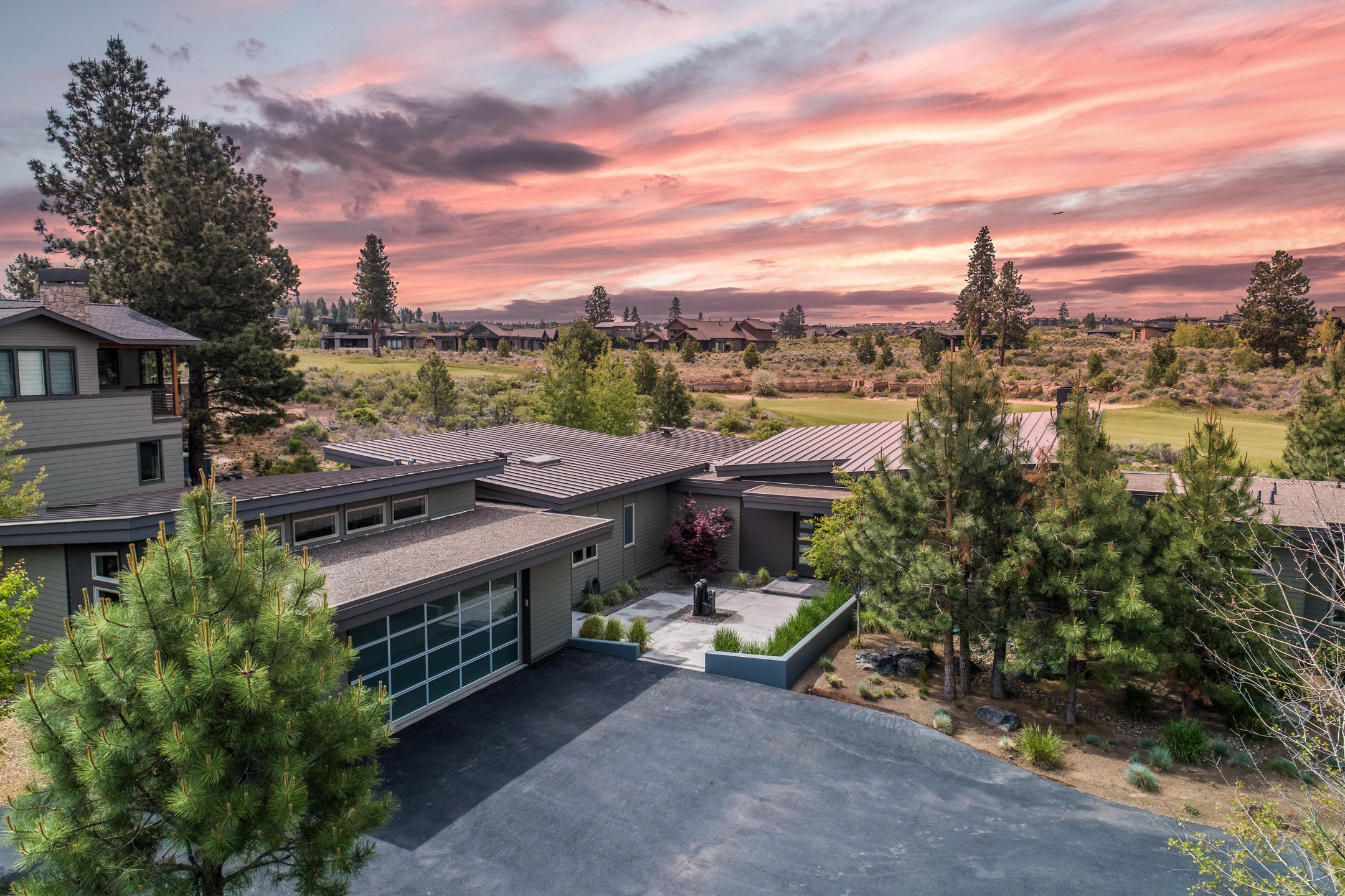 From the moment you walk through the front door, this contemporary designed BendTrend home you will be captured by its spectacular views of the 13th fairway at Tetherow and Mt Bachelor and its beautiful gourmet kitchen with large island, breakfast bar, high end appliances, and large pantry with bar.

Other highlights include a spacious family room; a large master suite with sweeping views; a fitness room (or office); and a tandem three car garage with plenty of storage, radiant heated floors, and an indoor/outdoor kennel. 

Outside you can enjoy the hot tub, large grass area with room to run and play games, and kids (young and old!) can play on the in-ground trampoline. The backyard is wired for an electric fence system (previously Invisible Fence but can be used for other systems)

The home is certified Earth Advantage Platinum and designed to be extremely efficient and full of light. It features 8-inch exterior walls, 14-inch insulated ceilings, radiant floor heat, and LED lights.