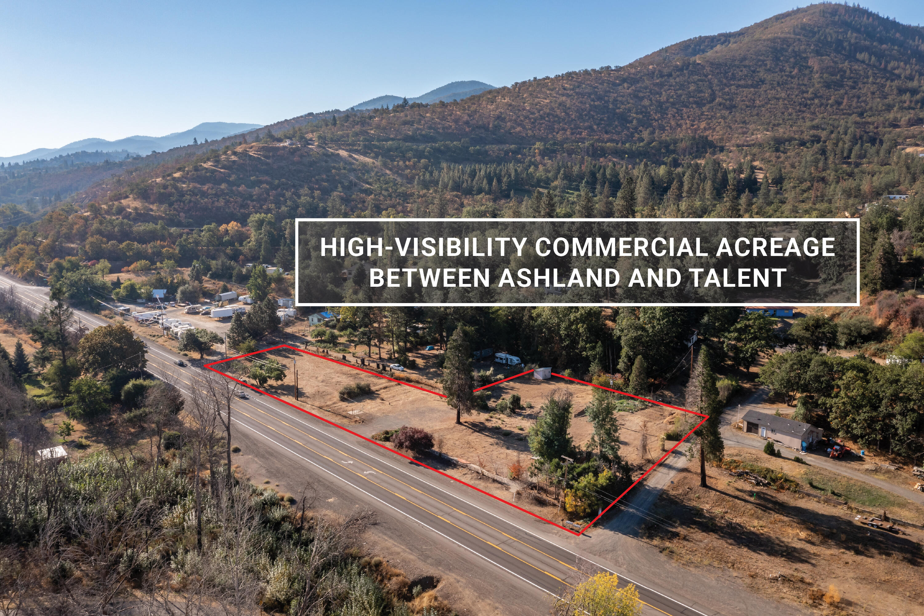 High-visibility commercial acreage between Ashland and Talent with ODOT-approved access and over 450 feet of South Pacific Highway frontage. Property features cleared and level building areas, mature trees, and irrigation rights through TID. As the former site of New Sammy's Cowboy Bistro, the land was cultivated as an organic garden for over 25 years. Public sewer, electric, and cable available. Jackson County lists nearly 100 different potential business uses in General Commercial (GC) zoning — including food and beverage, drive-through, medical services, recreation, entertainment, retail, and wholesale operations — along with option for accessory residential use. Due diligence regarding development potential and lot split, disclosures, soil samples, maps, and title information available. Inquire for details!