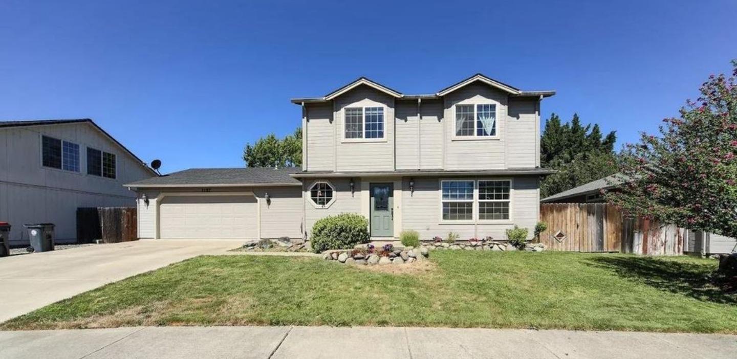 Great three bedroom 2 1/2 bath home with over 1750 Sqft. Huge open kitchen with hardwood floors and abundant cupboard space. Dining area is located right off the kitchen with a slider leading to the back yard. Nice living room that allows natural light. Great size indoor laundry room. Upstairs you will find a large master bedroom with two different closets. The other two rooms are good sized also. This home is very clean and well cared for. The over-sized garage, covered patio and small space on the side is perfect for some toys or storage.