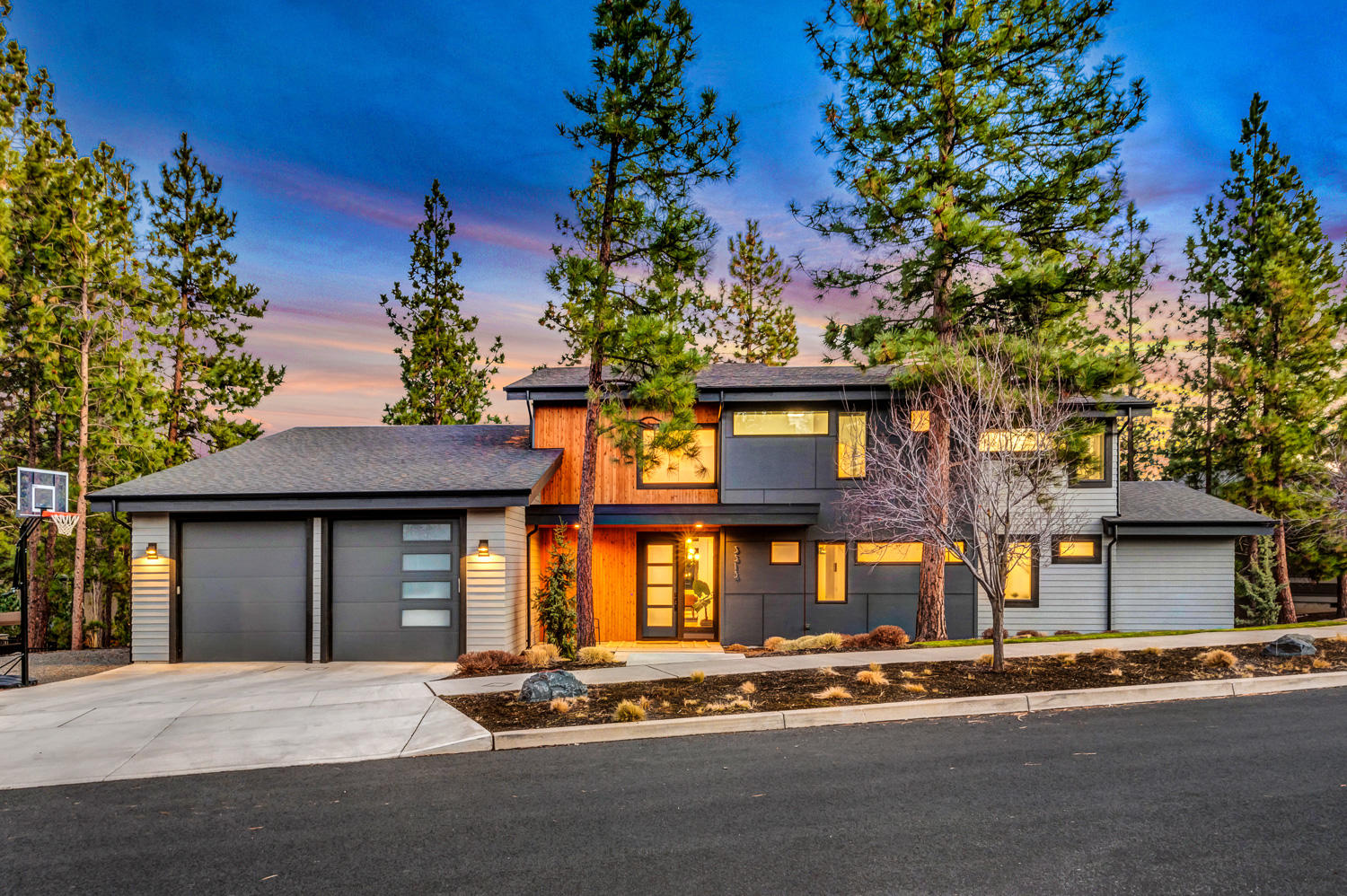 Towering windows and lofty ceilings frame this magnificent, custom built, Shevlin Ridge home with natural light and vibrant sunrises providing the perfect backdrop to your everyday life. The heart of the home is anchored by the designer kitchen with quartzite counters, oversized island and an open concept that flows effortlessly into the stunning living and dining areas. Enjoy seamless access to the captivating backyard with covered dining, multiple seating areas & custom gas fire pit. Main-level owner suite has backyard access, vaulted ceilings & multi-room closet. The main level also includes a 2nd en-suite bedroom, large mud/laundry room & spacious garage with tandem bay, 10ft garage doors & extra high ceilings for gear/toy storage. The second level opens onto an open-air bonus room, 2 beds with ample windows, a full bath & an additional home office/5th bedroom. Constructed by Leader Builders, on a peaceful, coveted cul de sac, with world class access to all your outdoor adventures.