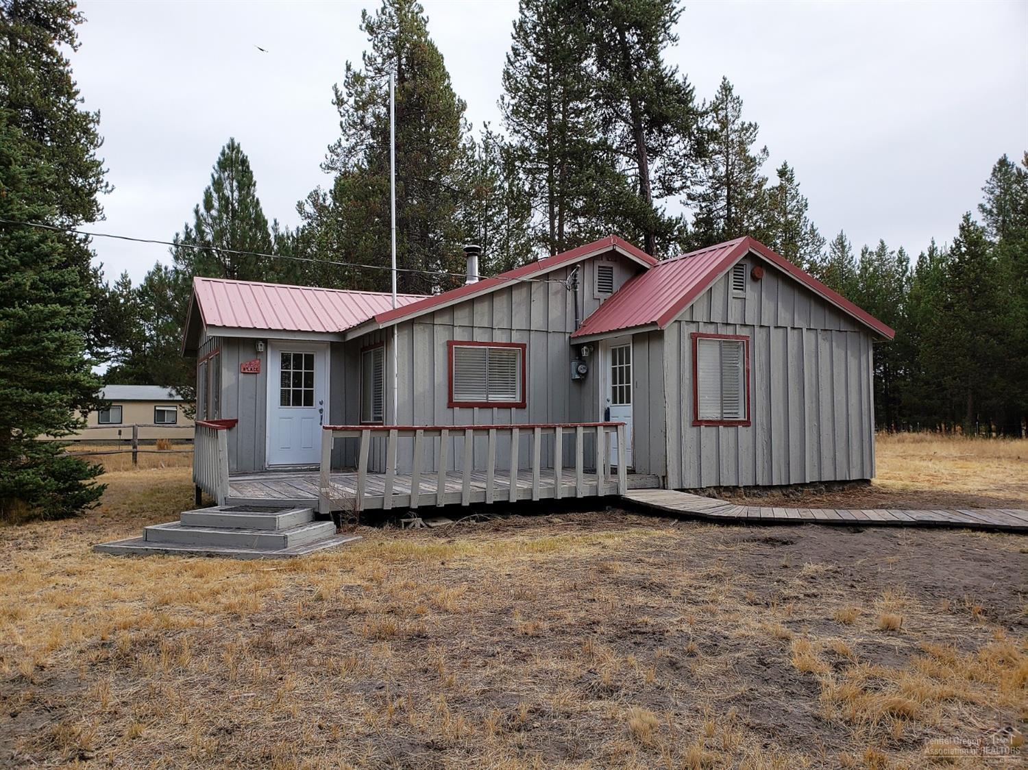 Come Make This Little Bungalow Yours! AS IS.... Needs TLC... granite tile counter tops, cabinetry & kitchen appliances. Bathroom tiled floor, shower/tub surround & granite tile counter top. Grounds are fenced, multiple storage buildings one with dog run. Relax on your deck and enjoy living in the Lazy River South Community. Gravel circular drive way provides space for your visitors. Enjoy All 4 Seasons of Central Oregon Recreation. Just minutes to Lakes, Rivers & Trails.