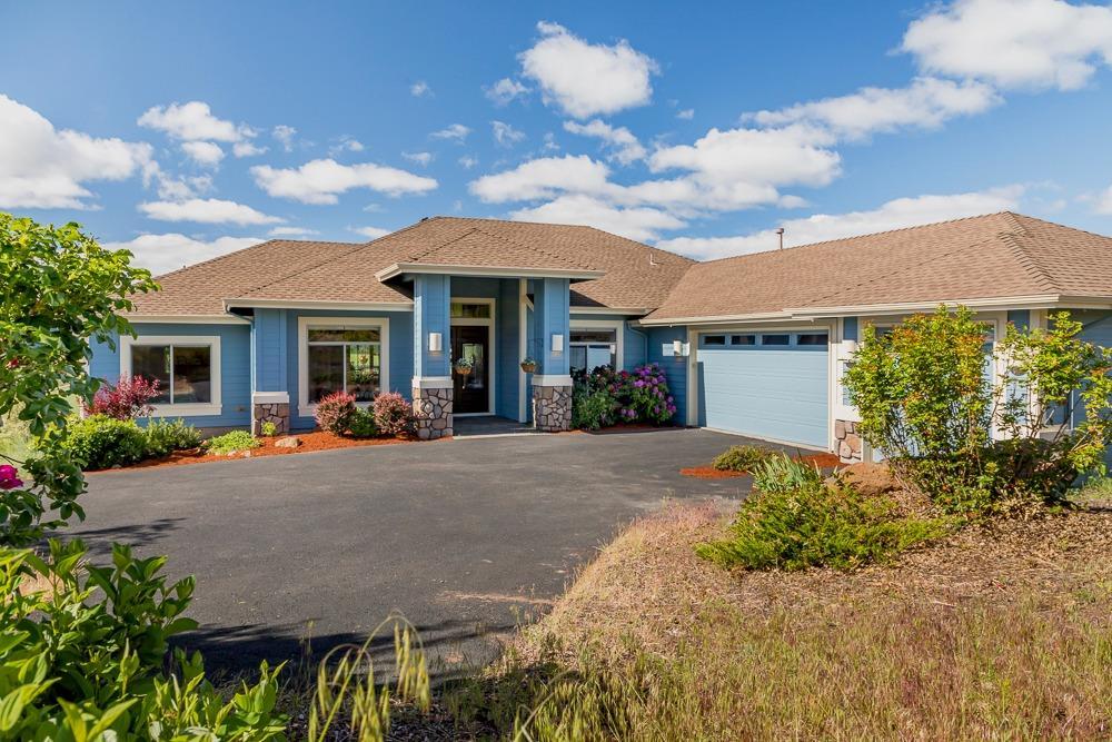 Expansive and ever changing views highlight this lovely one story home located in West Ridge at the Running Y. Enjoy sunsets from both decks. Sunrise, ranch land and mountain views take your breath away. All on one level, the split bedroom plan is a spacious 2500 square feet. There is a separate office with glass French doors, dining room, breakfast nook and secure storage in the basement area.The 3 car garage is easily accessed by the level driveway, Features include newer red oak wood floors, central vacuum system, new dishwasher and microwave, gas heat and granite counter and Kitchen Island. The home is located on nearly one acre and boasts blooming plants, trees and mature landscape This home is a must see.