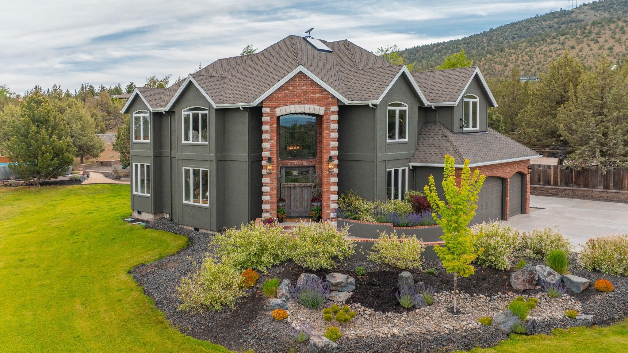 This completely updated home offers the perfect blend of rustic charm and refined elegance, with a balanced combination of natural elements and modern finishes. The rustic features such as metal and reclaimed accents add warmth and character, while the refined touches, like quartzite counter tops, steel wrapped fireplace and contemporary fixtures create a sophisticated atmosphere. Heated floors in the primary bath.  All bedrooms upstairs.  
New zoned heating and AC units.
Beautifully landscaped yard, with new 3 hole putting green, perfect for outdoor entertainment or relaxing. 
Home sits on 5 acres with great mountain views and views from almost every room.  Two huge paver patios, propane fire pit and outdoor TV.  Beautiful fenced, raised bed garden.                                                                                       Huge 40' x 42' shop with 2) 10' x 8' doors and 1) 12' x 16' door.

See attached documents for list of updates to this beautiful home.