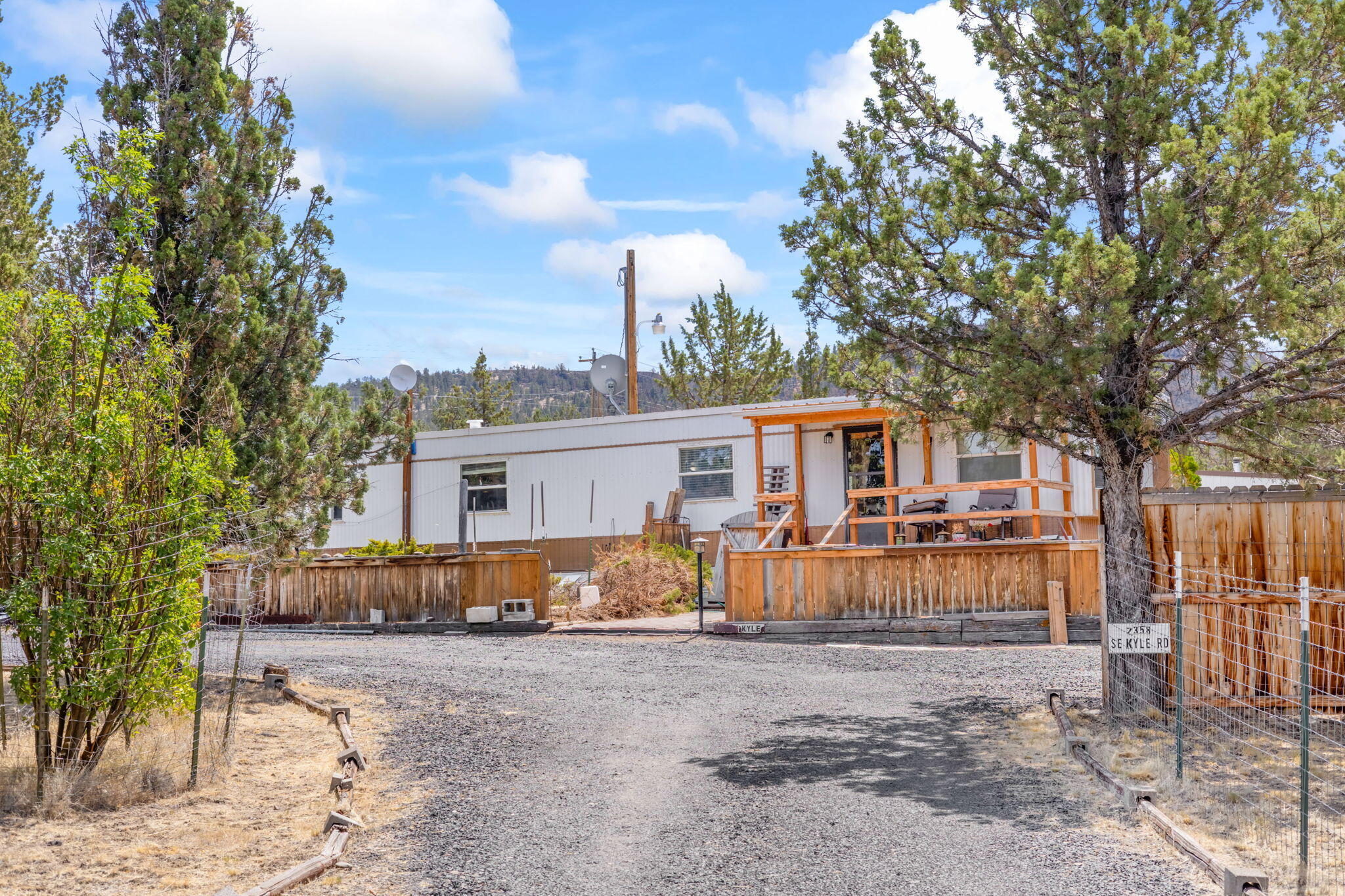 Don't miss out on this wonderful home sitting on just over 2 acres. Only minutes from town but far out enough to enjoy the peace and quiet. This well kept single wide has a few recent upgrades such as a new mini split heating and cooling system and an energy grant for crawl space renovation as well as a new roof, all in 2023. This is a great corner lot that features a large 24x30 detached garage with a workbench and a 20x24 insulated shop with concrete floor and 220v power! Plenty of room for all your toys and hobbies and just a short drive to Prineville Reservoir.