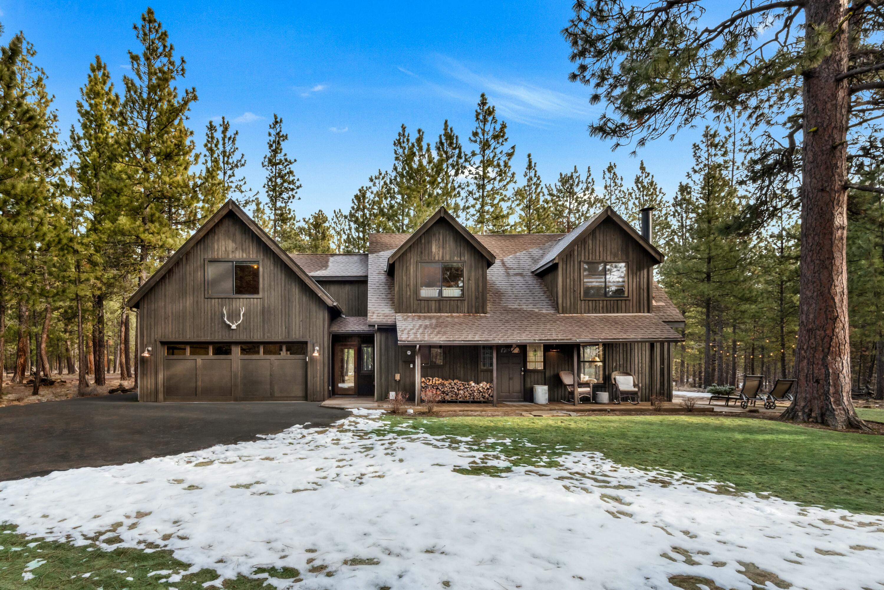 Introducing Rock Ridge 069, a cozy retreat nestled next to the Deschutes National Forest. This updated and charming home sits on 0.49 acres of serene forest landscape, providing privacy and adventures at your front steps. The main level features a guest bed, full bath, a roomy kitchen, and a dining area ideal for hosting guests. The welcoming great room boasts a stunning wood-burning stone fireplace and ample windows that frame the natural surroundings. Upstairs, discover a spacious primary suite, two more bedrooms, a full bathroom, and a versatile office/ flex space. The landscaped grounds include a covered front porch, a large stone patio perfect for gatherings, & a hot tub for relaxation. Convenient access to the Glaze Meadow Rec Center at Black Butte Ranch provides year-round recreation and wellness options, enhancing the lifestyle experience for residents & families alike. This fully furnished home is move-in ready, offering a blend of comfort and convenience for its new owners.
