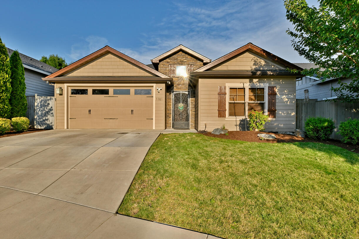 Welcome home to this charming Craftsman-style 3 bedroom, 2 bath residence in the highly desirable East Gate Estates. Step inside to an open floor plan with soaring 9-foot vaulted ceilings and a cozy gas fireplace with custom stone surround and mantle. The gourmet kitchen features a spacious center island, perfect for gatherings. The backyard oasis with patio, built-in BBQ, and outdoor fireplace — perfect for entertaining!
