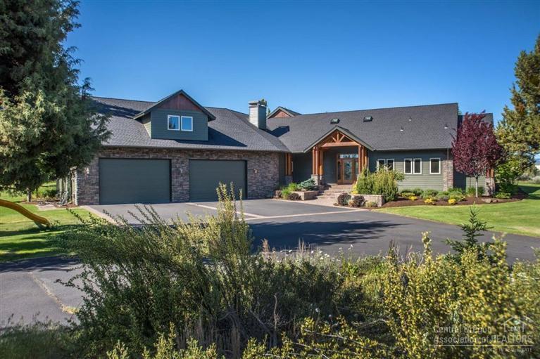 Enjoy your own private paradise in NE Bend. Cascade Mtn Views on nearly 3 acres of gently rolling grounds, expansive lawns & natural landscape. NW style custom home w/stone & timber accents, paver patios & covered outdoor living. Inside you'll discover architectural beauty w/soaring vaults framed by graceful arches, a sweeping spiral staircase & floor to ceiling wndws. Entertainer's kitchen, bar & family rms. Master Suite w/spa style bath & steam shower, heated Travertine flrs. Pool & Pull thru RV Garage!