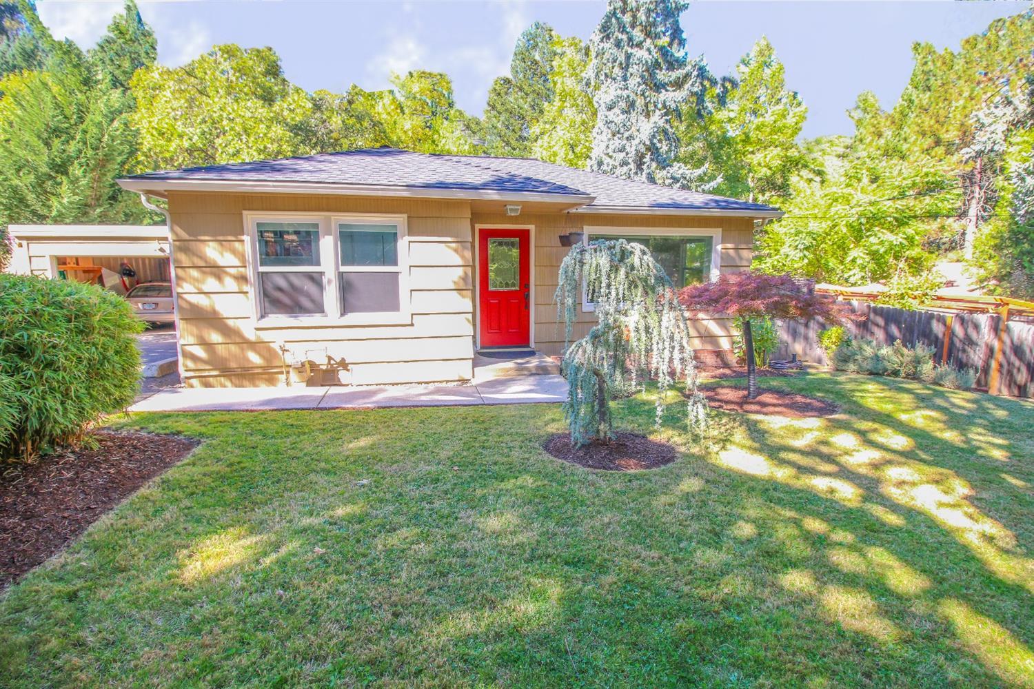 Completely renovated & updated as of 2013! This charming single story cottage has it all! New kitchen with lots of natural light, bamboo floors, no-slam drawers, and stainless appliances. Cheery Living room with naturally flowing floor plan and refinished oak floors, 3 beds/2 baths, including the hidden master which features his/hers closets as well as deck access from the lg master bath. Granite counters in kitchen and master. This bungalow sits on over 1/2 acre with Daisy ck meandering through the middle, accessible from the solidly constructed cedar deck off the rear of the home. Plenty of room for parking all your toys as well as driveway access to the back portion of the property which should have room to build an ADU (buyers to do due diligence) The attached 2 car garage also has a pass through door to access the back yard. New roof in 2016 with warranty, fully equipped with all appliances, storage in basement could be turned into a wine cellar. This home is a must see.