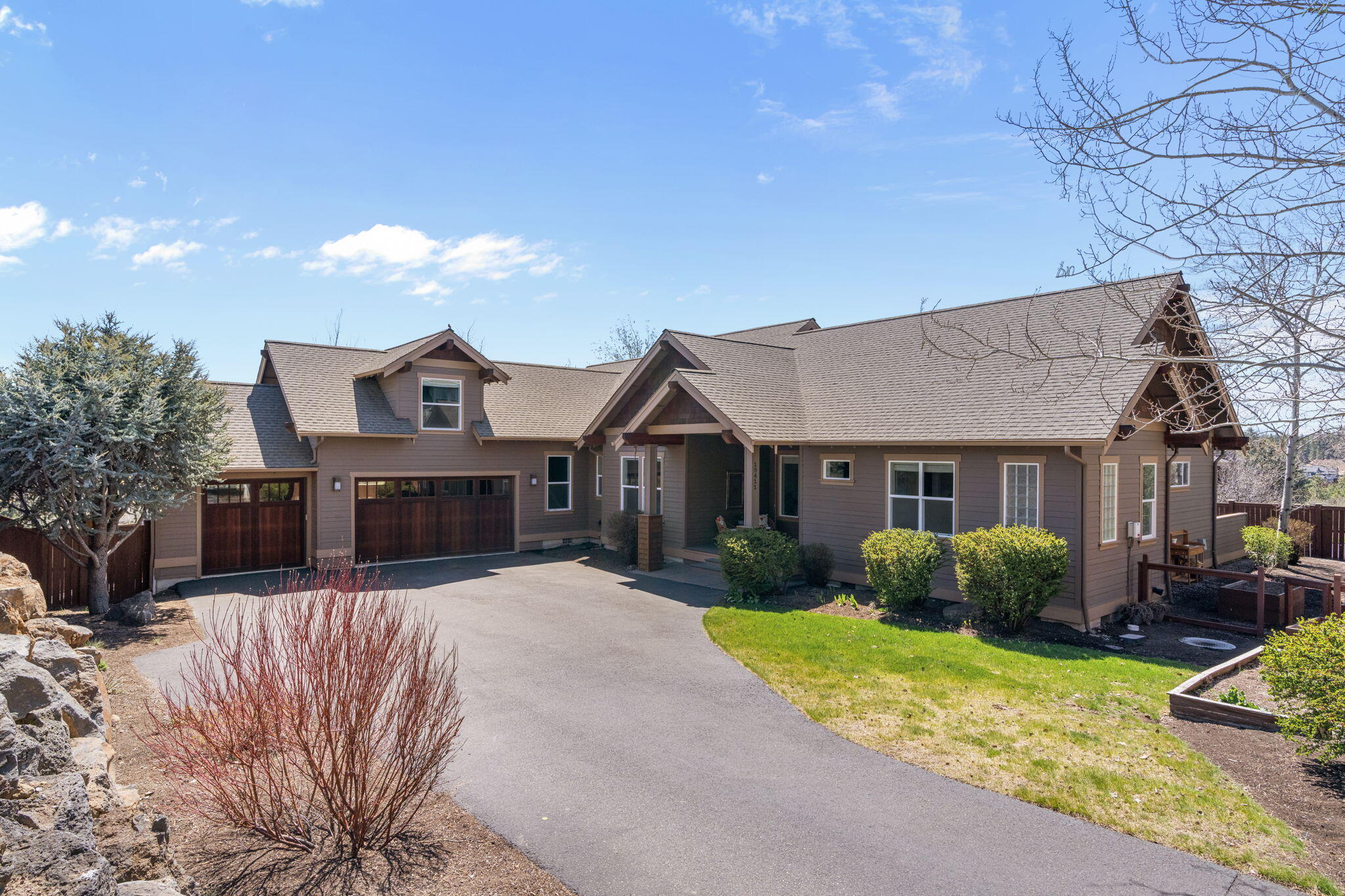 Tucked away on a private, tree-lined flag lot in one of Bend's most sought-after neighborhoods, this contemporary home blends sleek design with everyday comfort—framed by stunning Mt. Bachelor views. Soaring windows flood the open living space with natural light, while the chef's kitchen boasts premium appliances, streamlined countertops, and ample prep space. The spacious primary suite feels like a private spa, with hot tub access for starlit soaks after a day on the mountain. A smart layout offers privacy and flexibility, including a dedicated home office and versatile bonus room. The oversized 3-car garage—with epoxy floors and custom cabinetry—adds abundant storage. Enjoy easy access to nearby trails for biking, hiking, or peaceful walks. With Century Drive just around the corner, you're minutes from Mt. Bachelor and only five minutes to groceries, dining, and shops. A perfect basecamp for year-round adventure and relaxed Bend living.